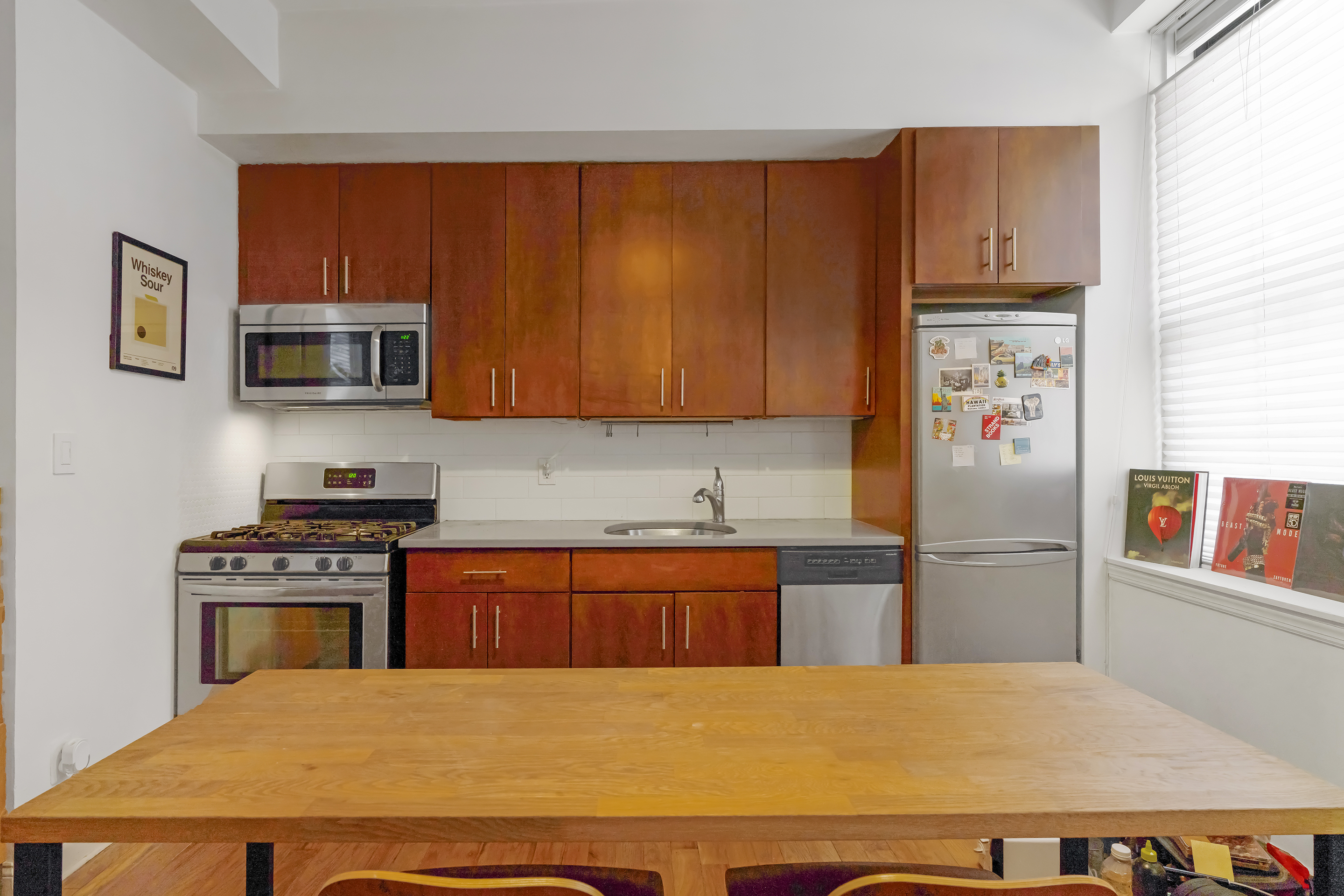 439 Hicks Street, Unit 1B Brooklyn, NY 11201 - Photo 2 of 7 a kitchen with stainless steel appliances granite countertop a refrigerator stove top oven with a sink and dishwasher