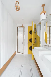 a bathroom with a tub sink and a mirror