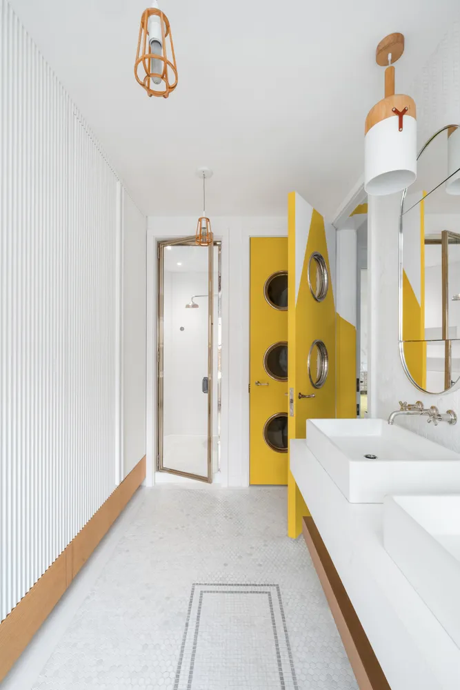 a bathroom with a tub sink and a mirror