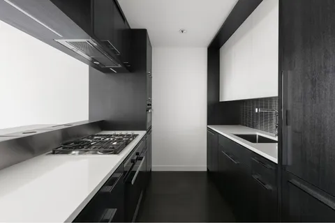 a kitchen with a stove and a microwave