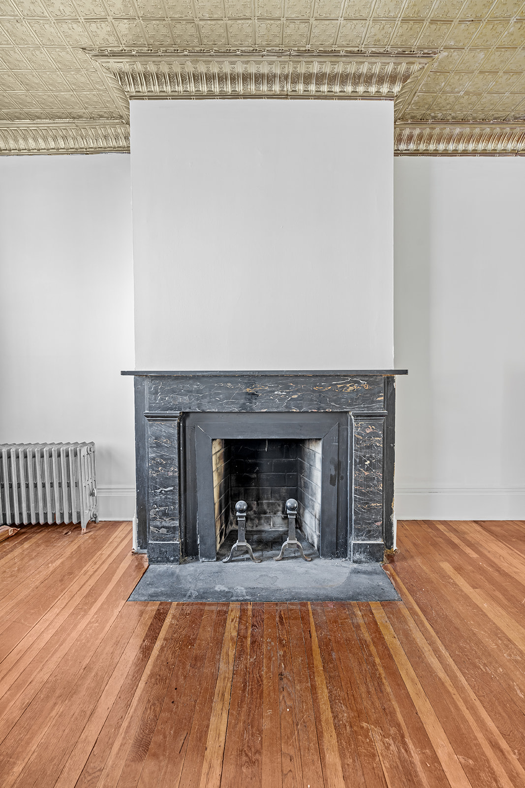 44 Butler Street Brooklyn, NY 11231 - Photo 4 of 22 a view of a livingroom with a fireplace and chandelier