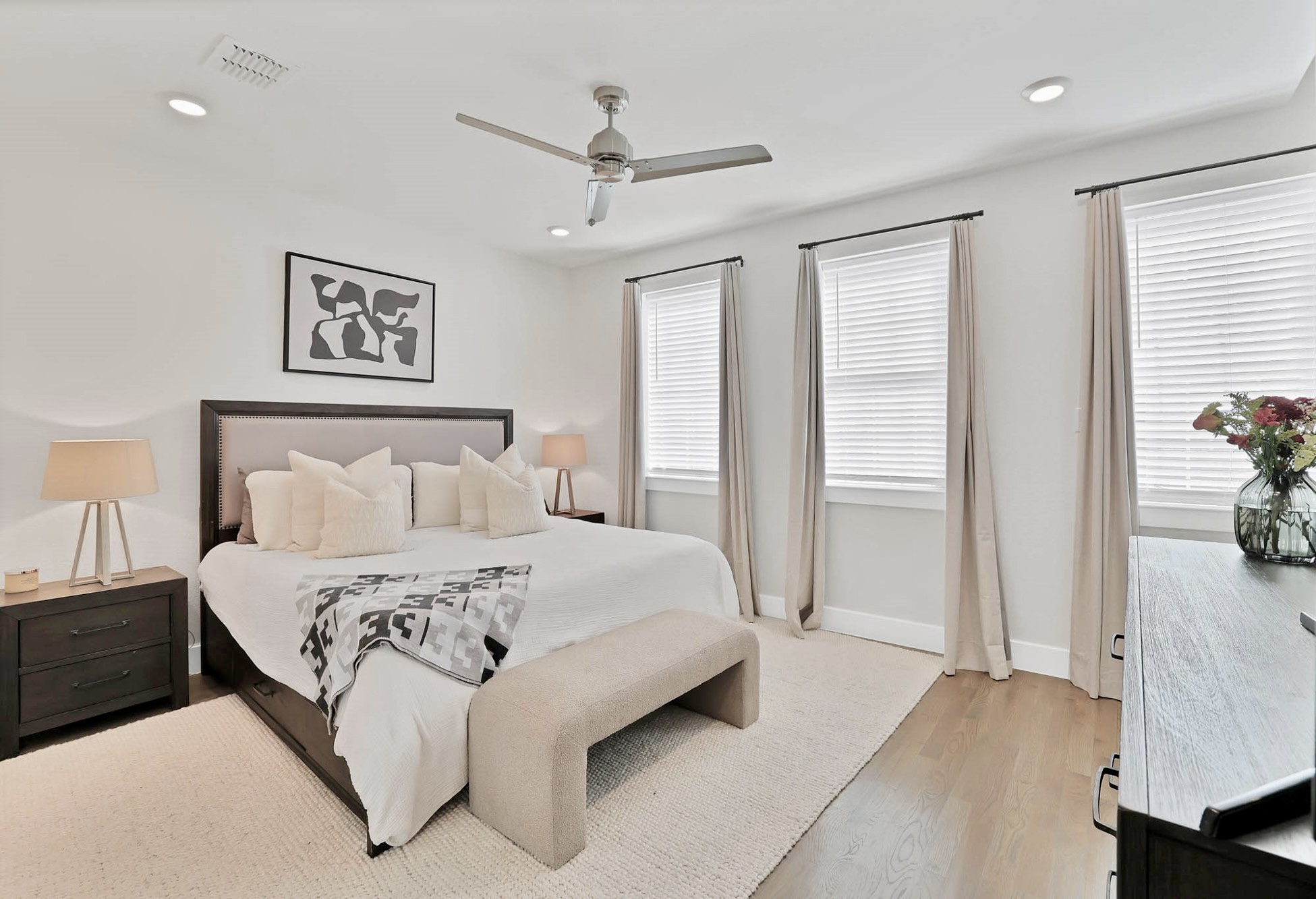 3920 Riesling Ridge Dallas, TX 75204 - Photo 15 of 26 a bedroom with a bed and a chandelier