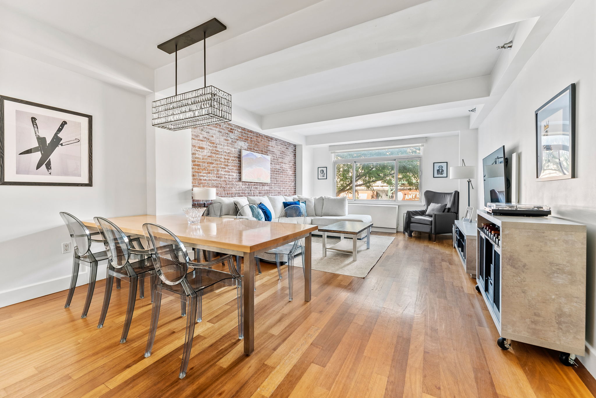 106 West 116th Street, Unit 2A Manhattan, NY 10026 - Photo 1 of 16 a view of a dining room with furniture window and wooden floor