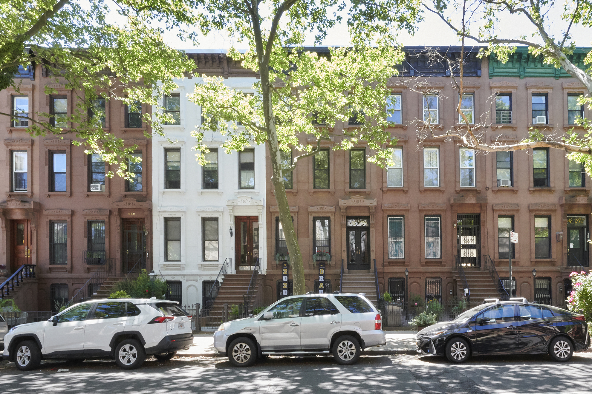 276 Stuyvesant Avenue, Unit 2 Brooklyn, NY 11221 - Photo 11 of 11 a buildings and cars parked in front of a building