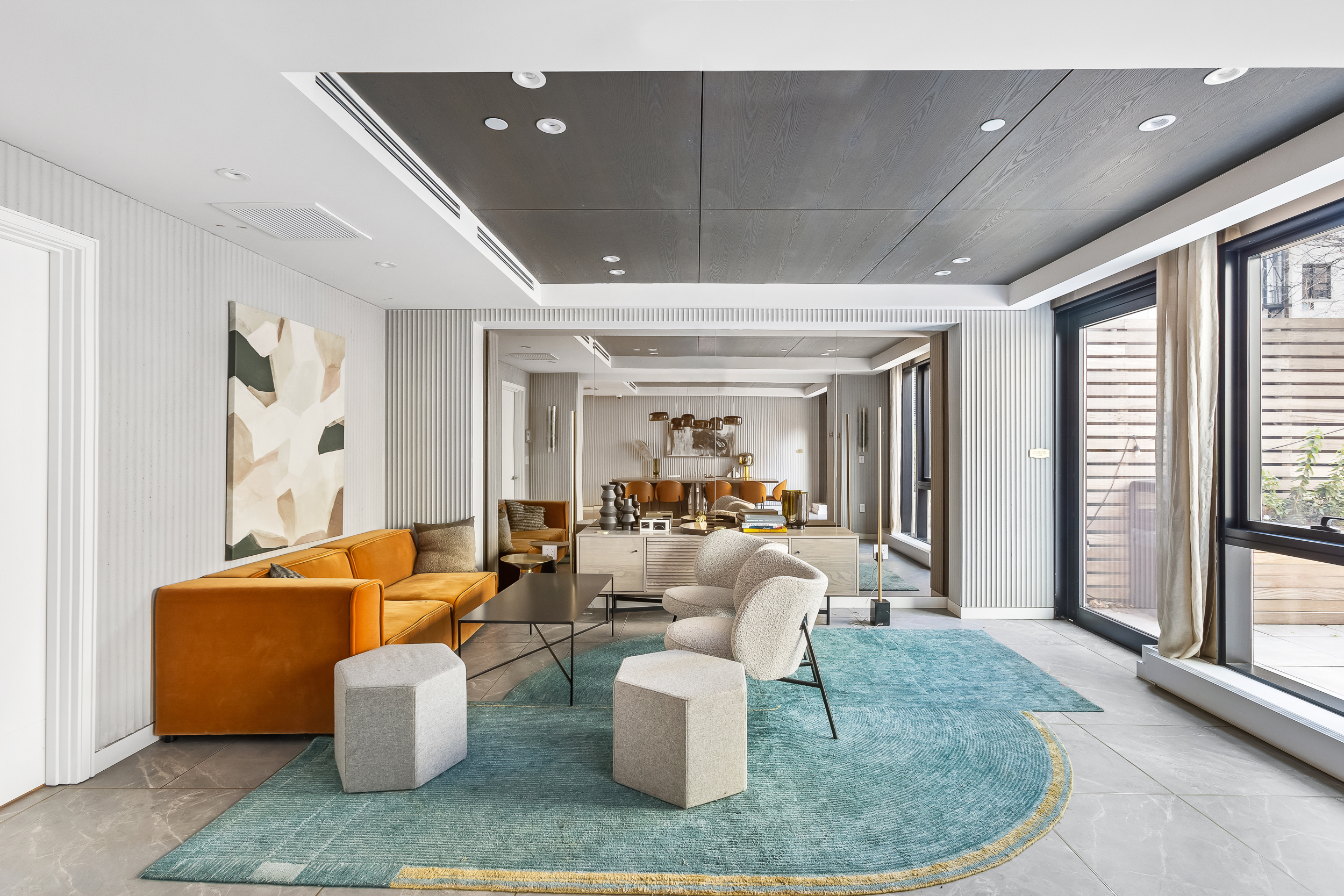 300 West 30th Street, Unit 7F Manhattan, NY 10001 - Photo 9 of 11 a living room with furniture and a large window