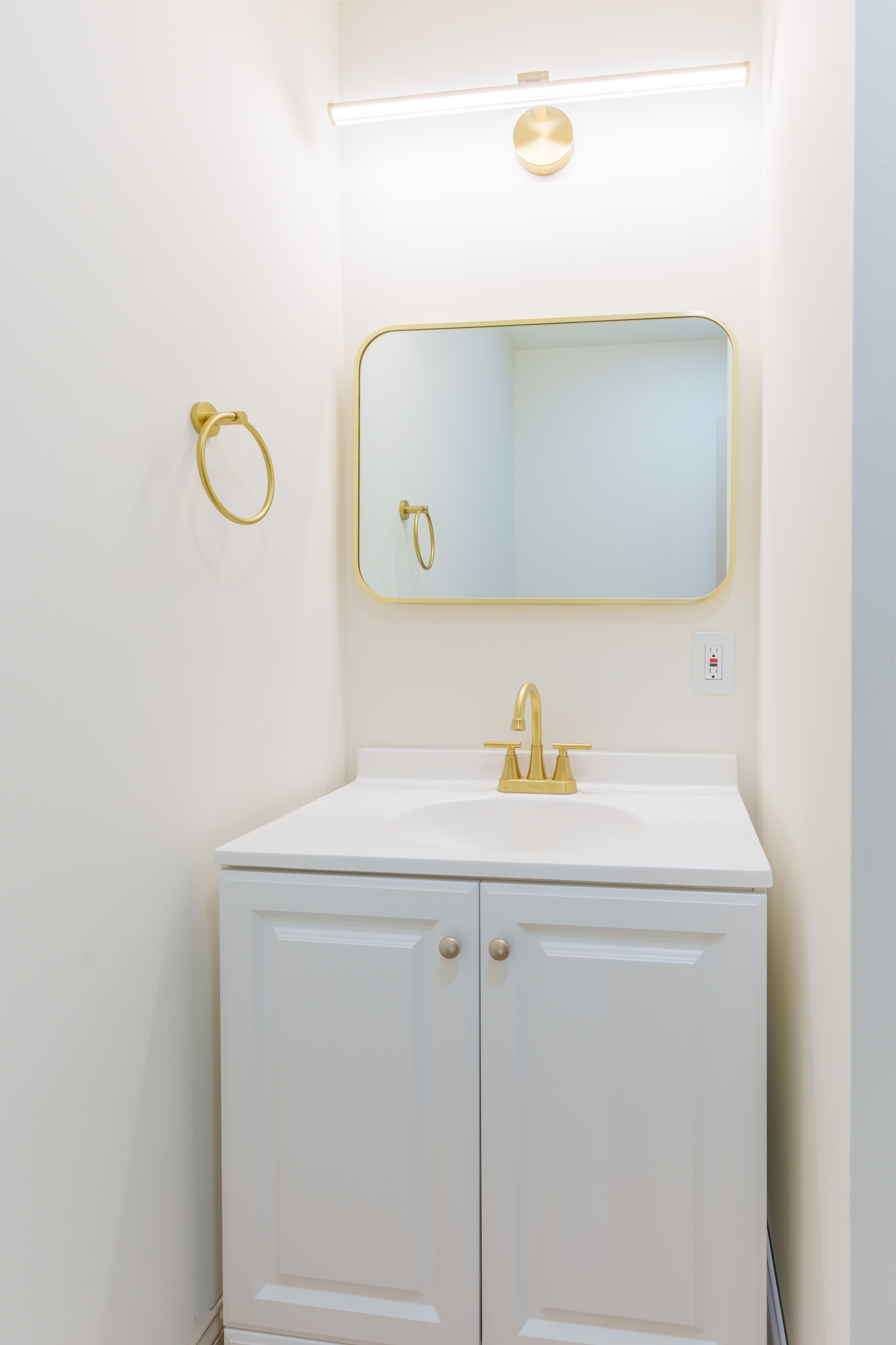 415 North Haddon Avenue Haddonfield, NJ 08033 - Photo 18 of 23 a bathroom with a sink and mirror