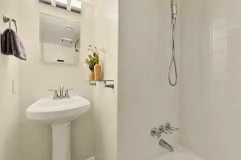 a view of an empty room with a fireplace