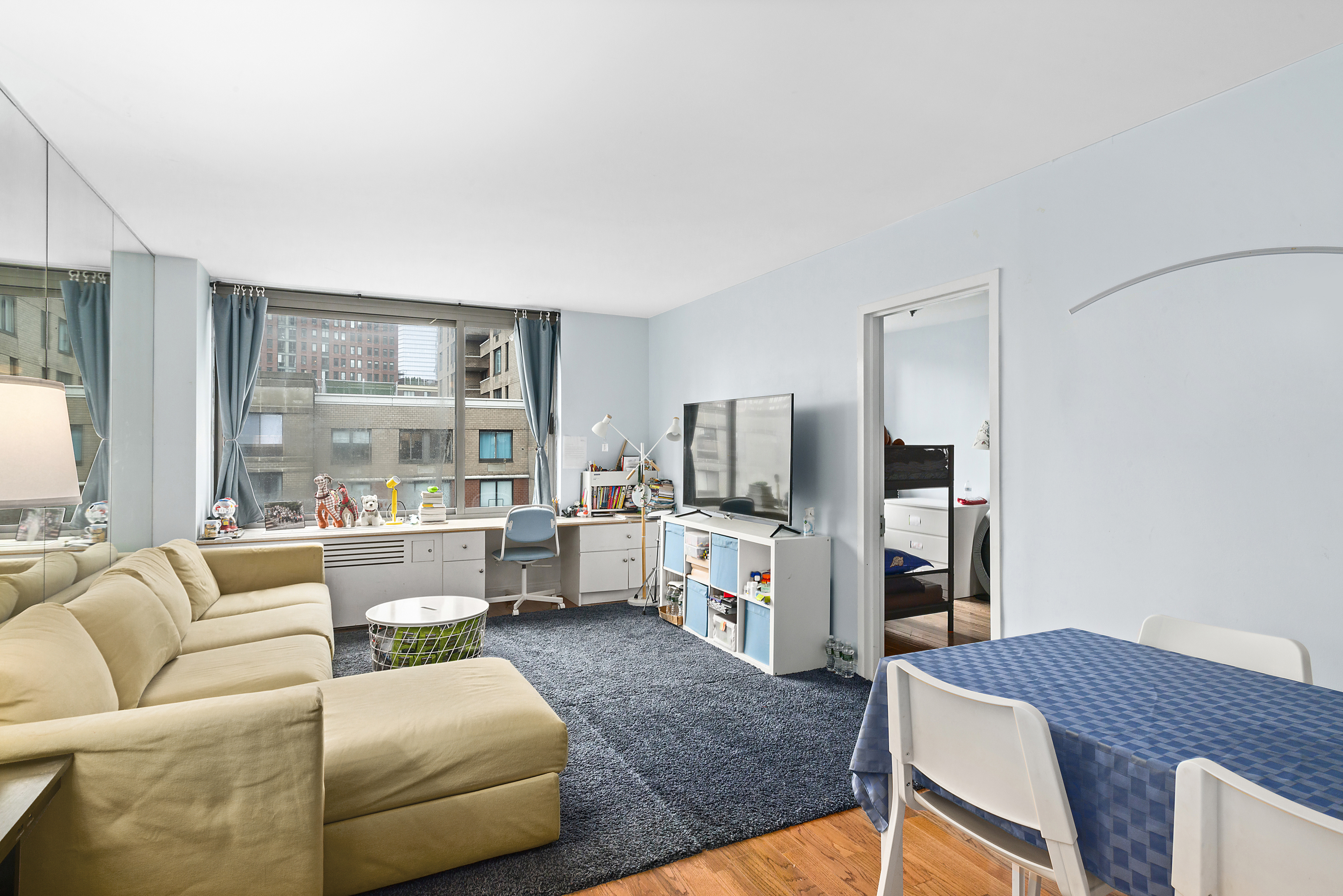 a living room with furniture and a flat screen tv