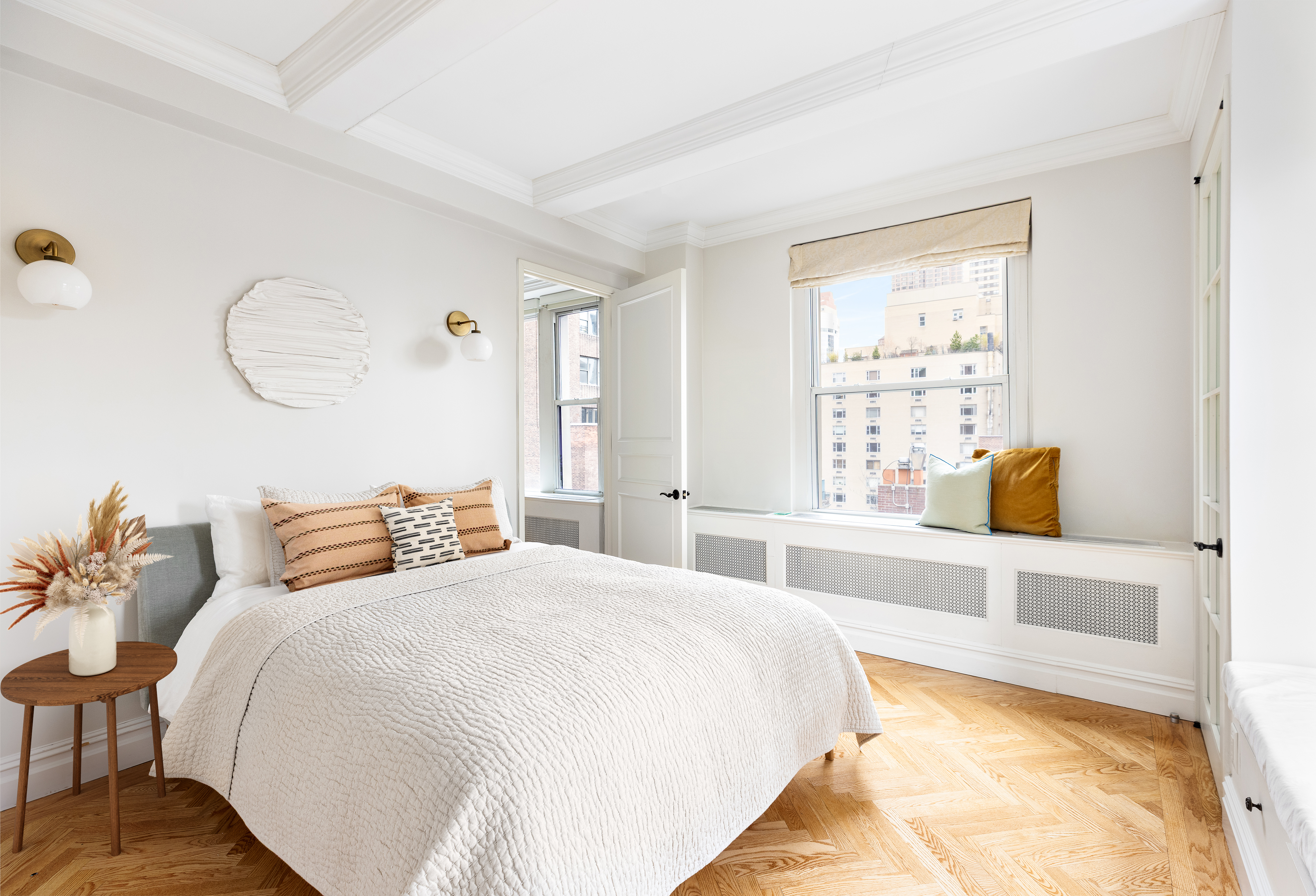 55 Park Avenue, Unit 9E Manhattan, NY 10016 - Photo 3 of 9 a bedroom with a bed and a window