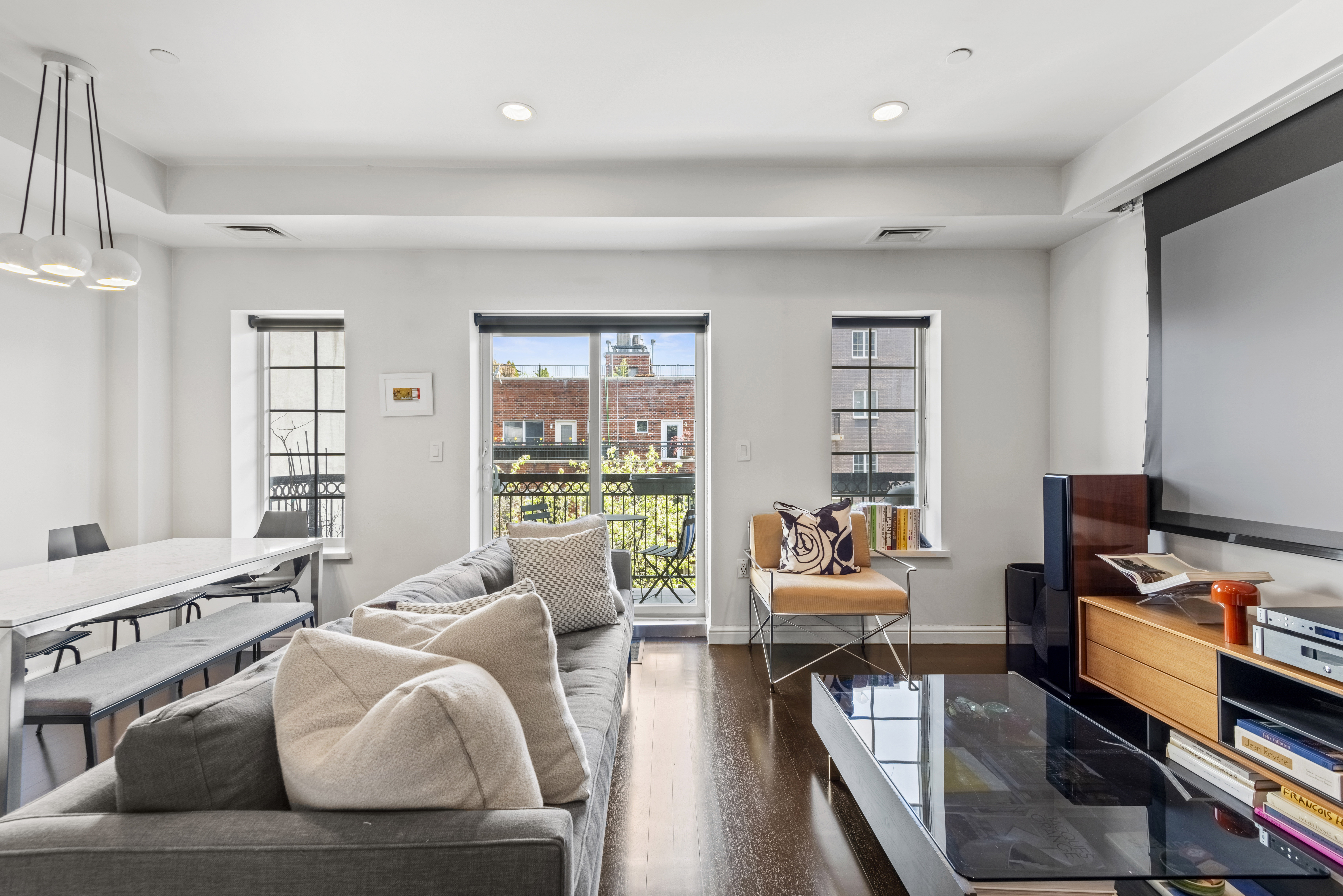 347 3rd Street, Unit C4A Brooklyn, NY 11215 - Photo 2 of 11 a living room with furniture and a window