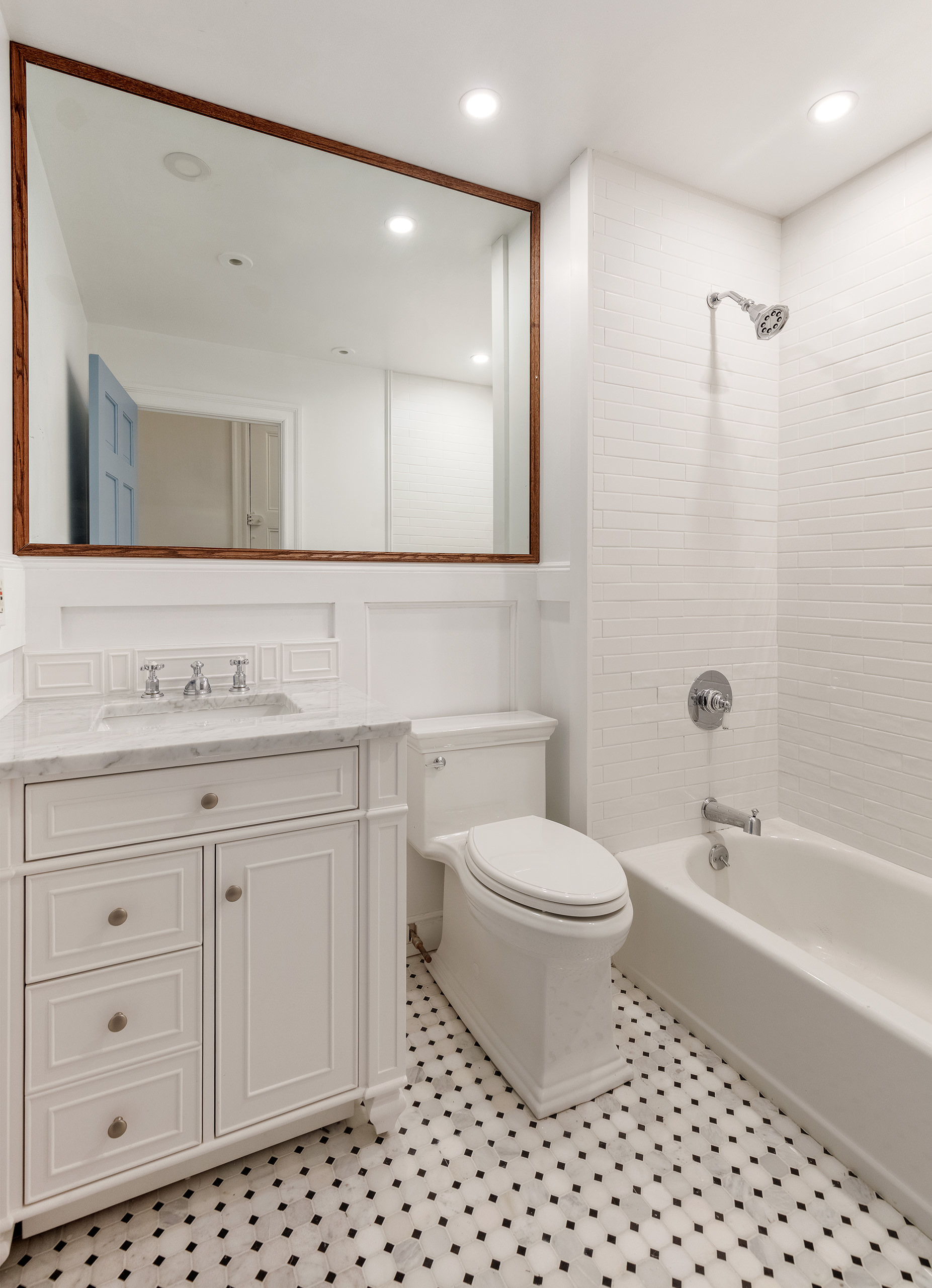 129 East 61st Street, Unit 3 Manhattan, NY 10065 - Photo 10 of 13 a bathroom with a sink a toilet and shower