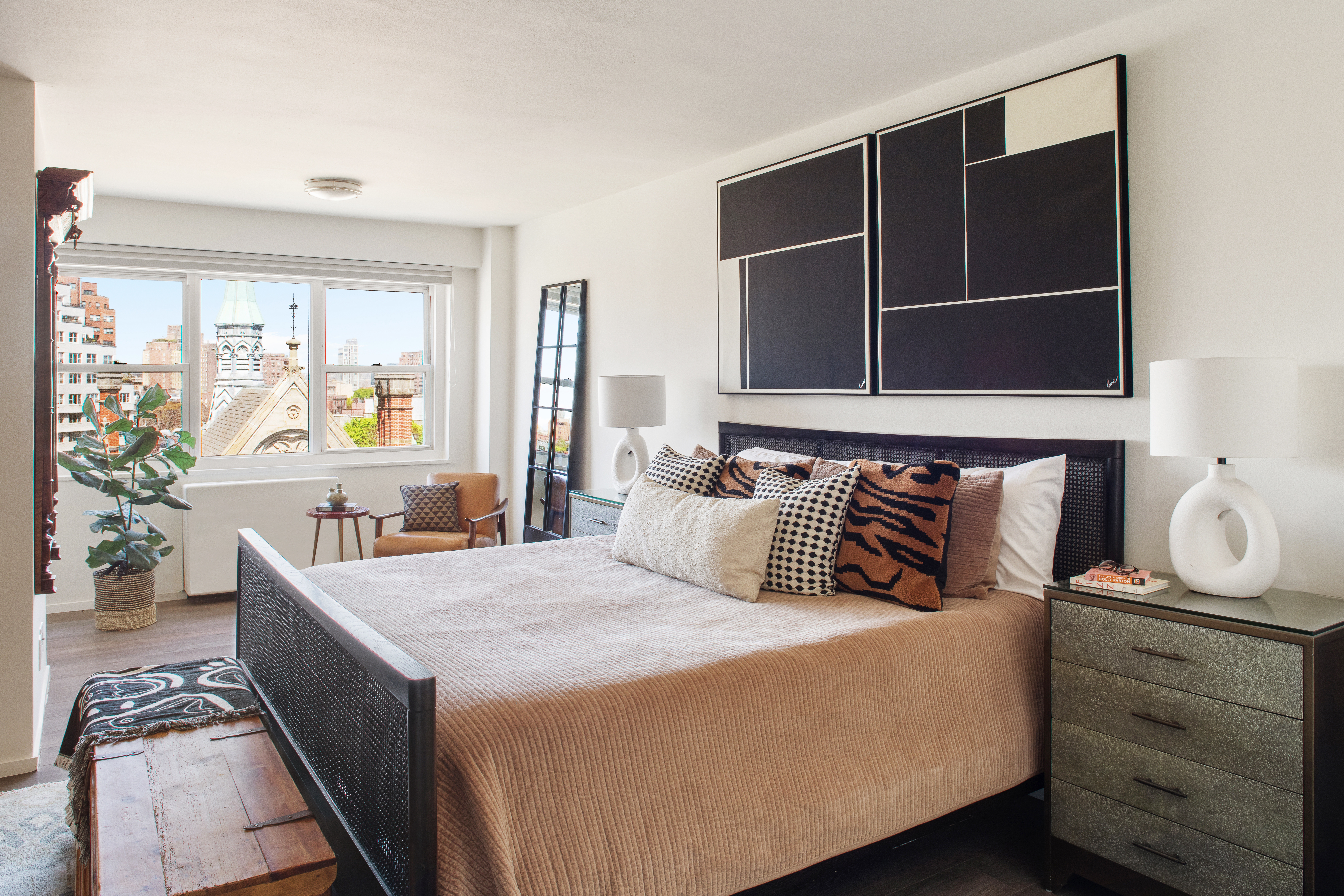 69 West 9th Street, Unit 11CDE Manhattan, NY 10011 - Photo 4 of 9 a bedroom with a large bed and windows