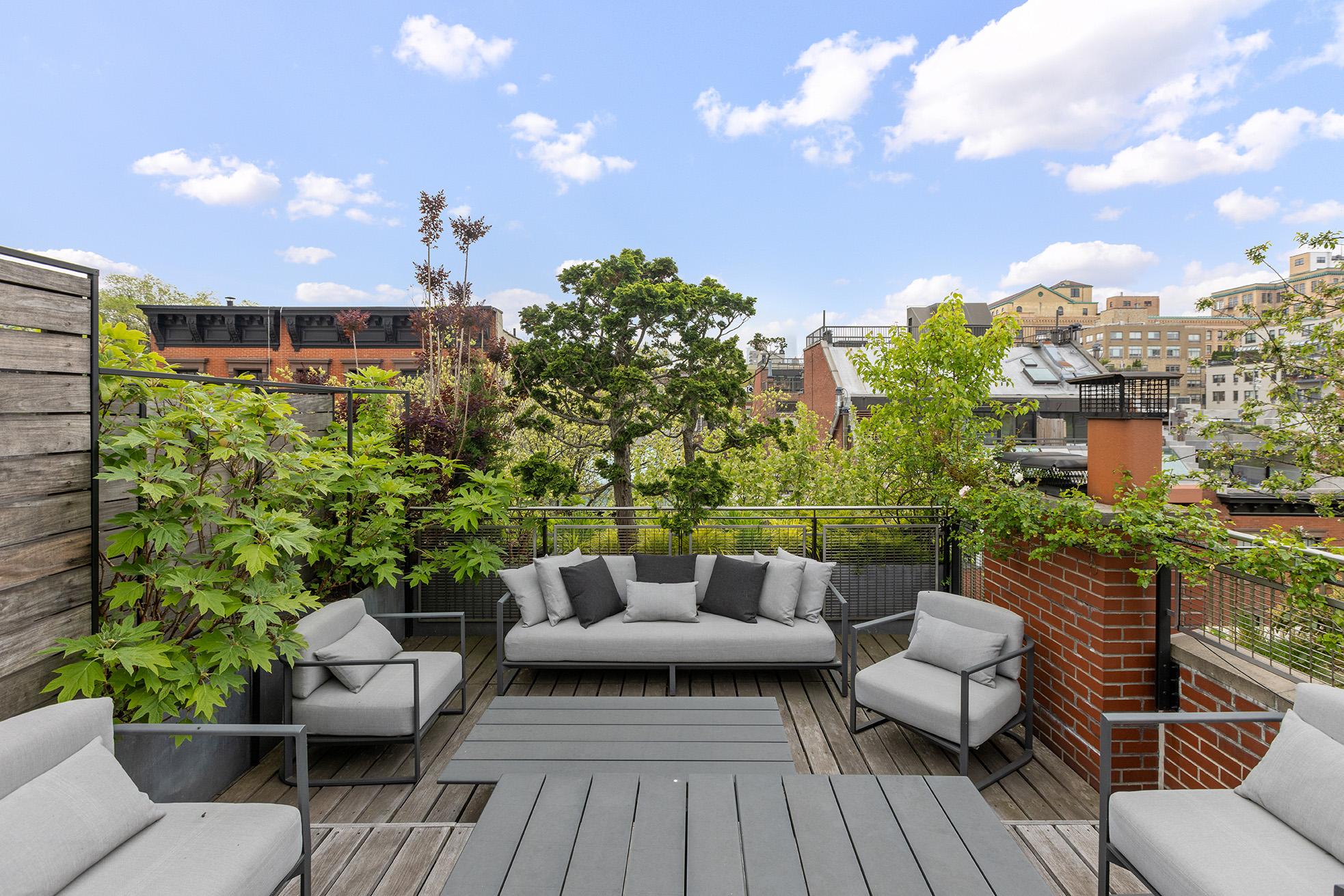 83 Jane Street Manhattan, NY 10014 - Photo 24 of 29 a view of a patio with couches and potted plants