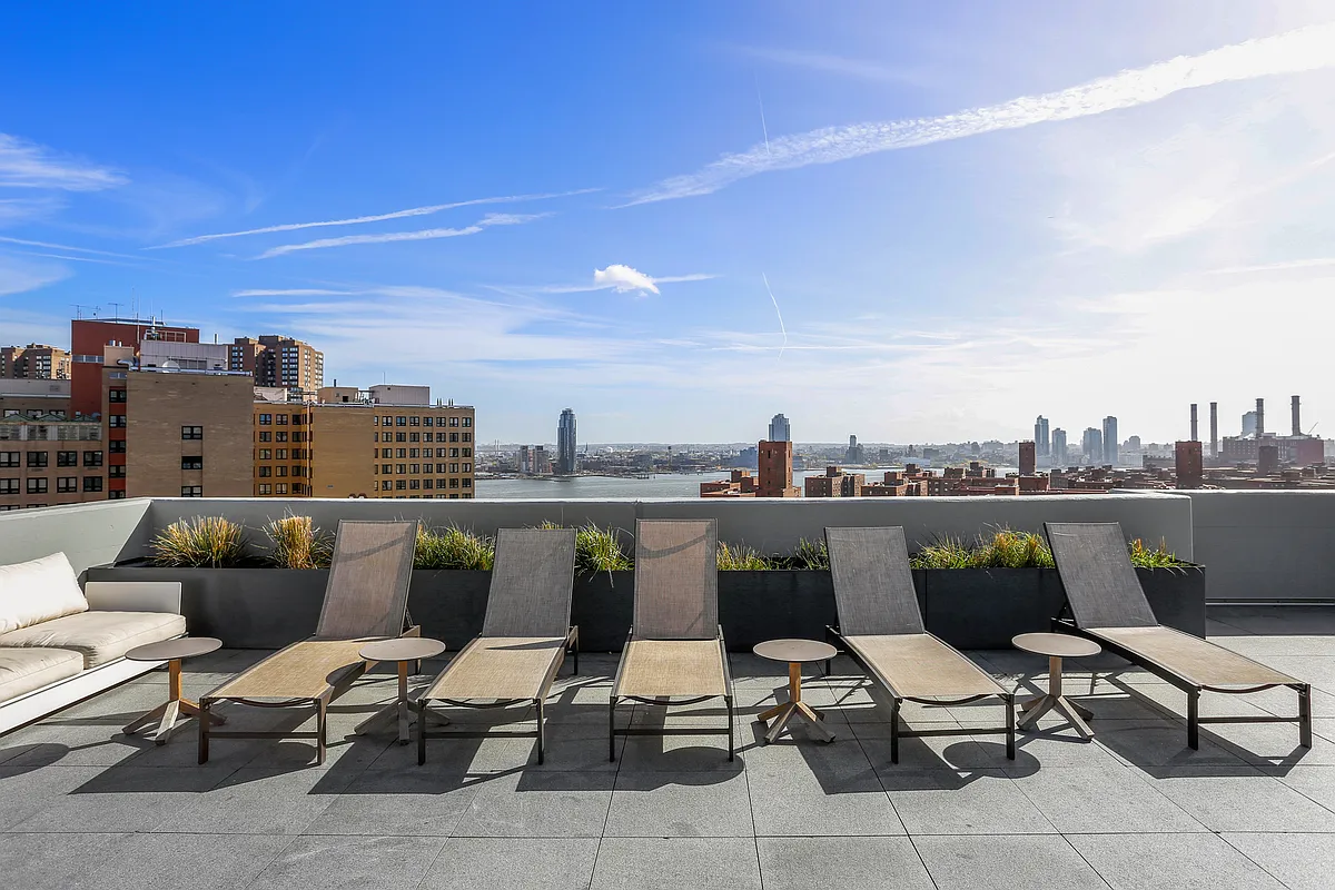 385 1st Avenue, Unit 18G Manhattan, NY 10010 - Photo 10 of 20 a view of roof deck with seating space and barbeque oven