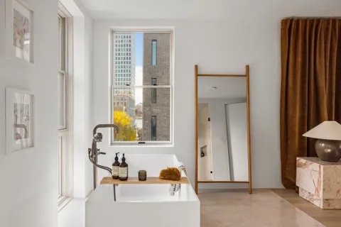 a bathroom with a tub and a sink