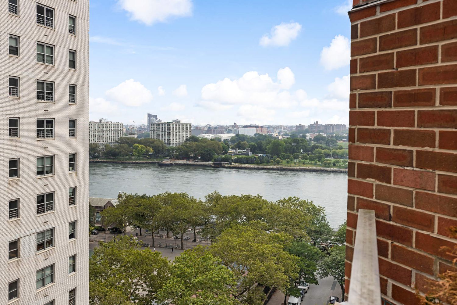520 East 76th Street, Unit PHC Manhattan, NY 10021 - Photo 5 of 15 a view of a lake with a building in the background