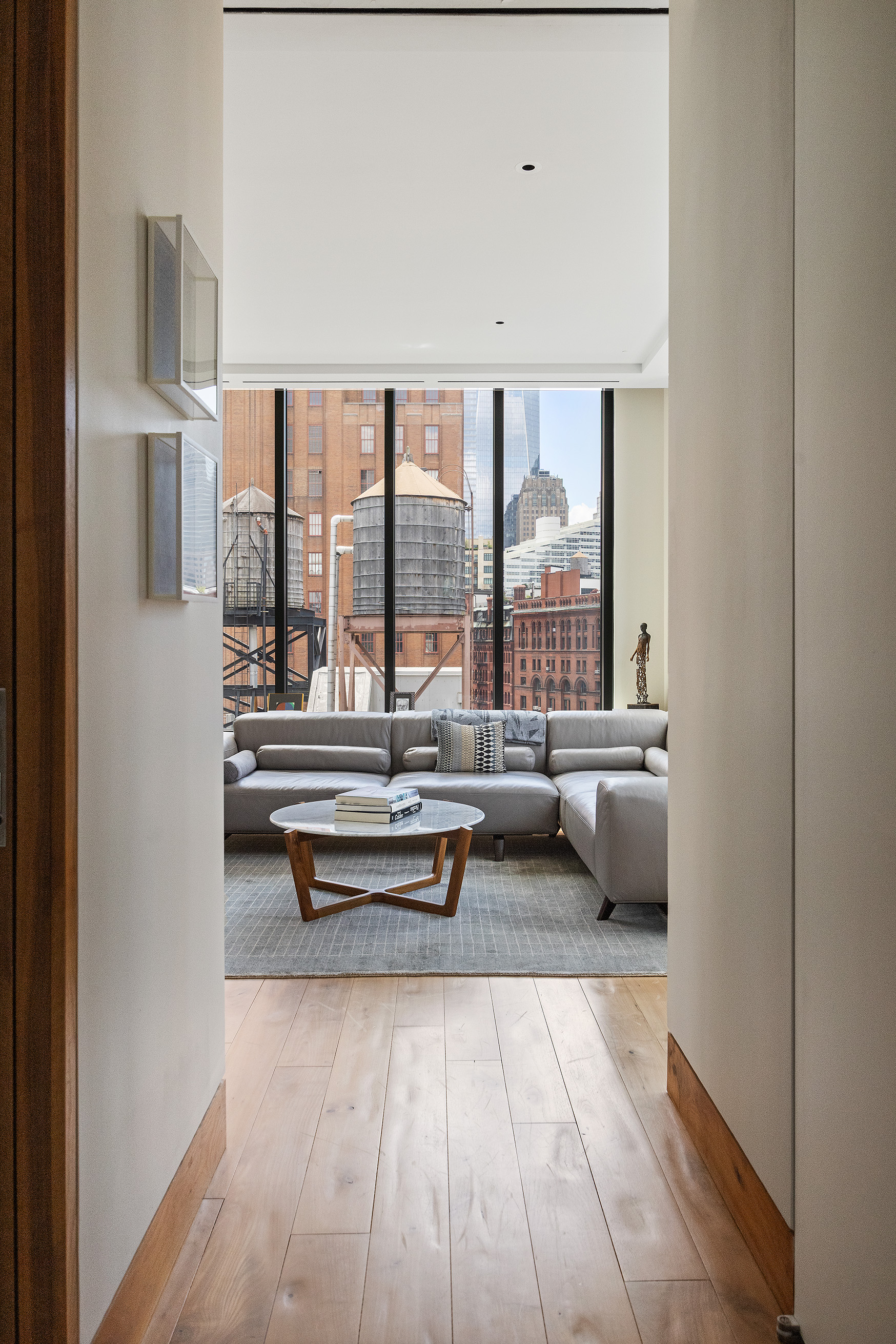 15 Leonard Street, Unit PH Manhattan, NY 10013 - Photo 20 of 37 a living room with furniture and large windows
