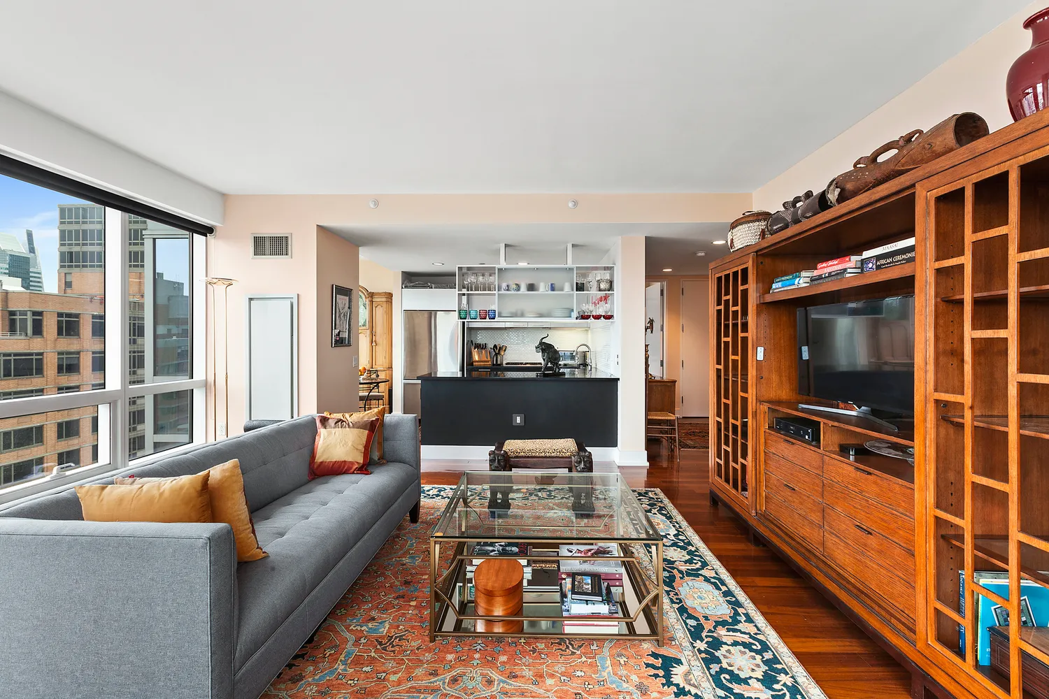 a living room with furniture and a flat screen tv