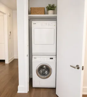 a view of a hallway with washer and dryer
