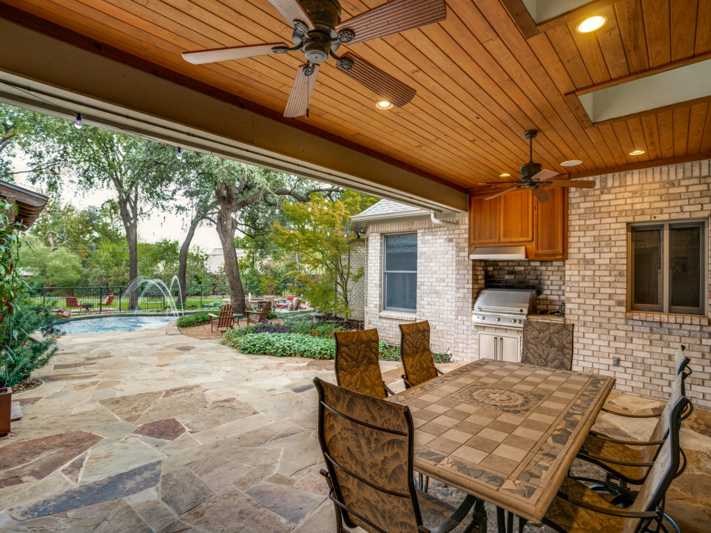 11503 West Ricks Circle Dallas, TX 75230 - Photo 37 of 39 a outdoor space with patio the couches and a fireplace