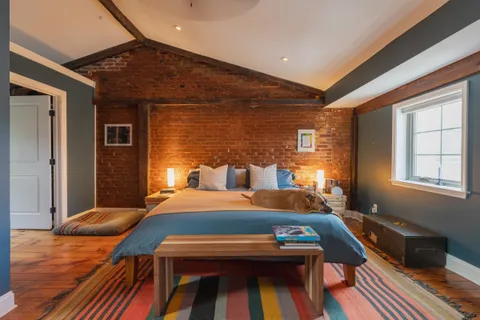 a bedroom with furniture and window