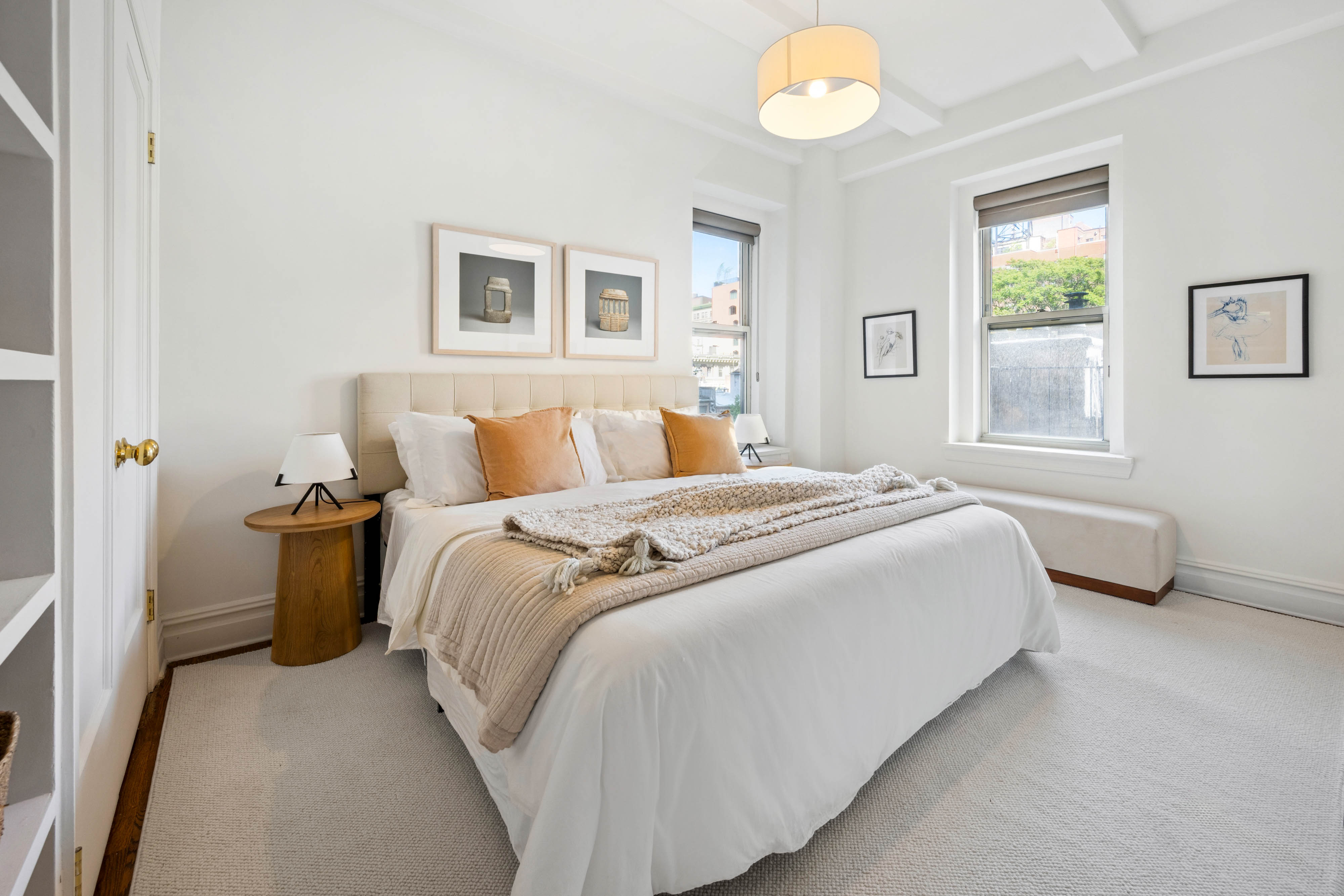 25 5th Avenue, Unit 6C Manhattan, NY 10003 - Photo 9 of 16 a bedroom with a bed and a window