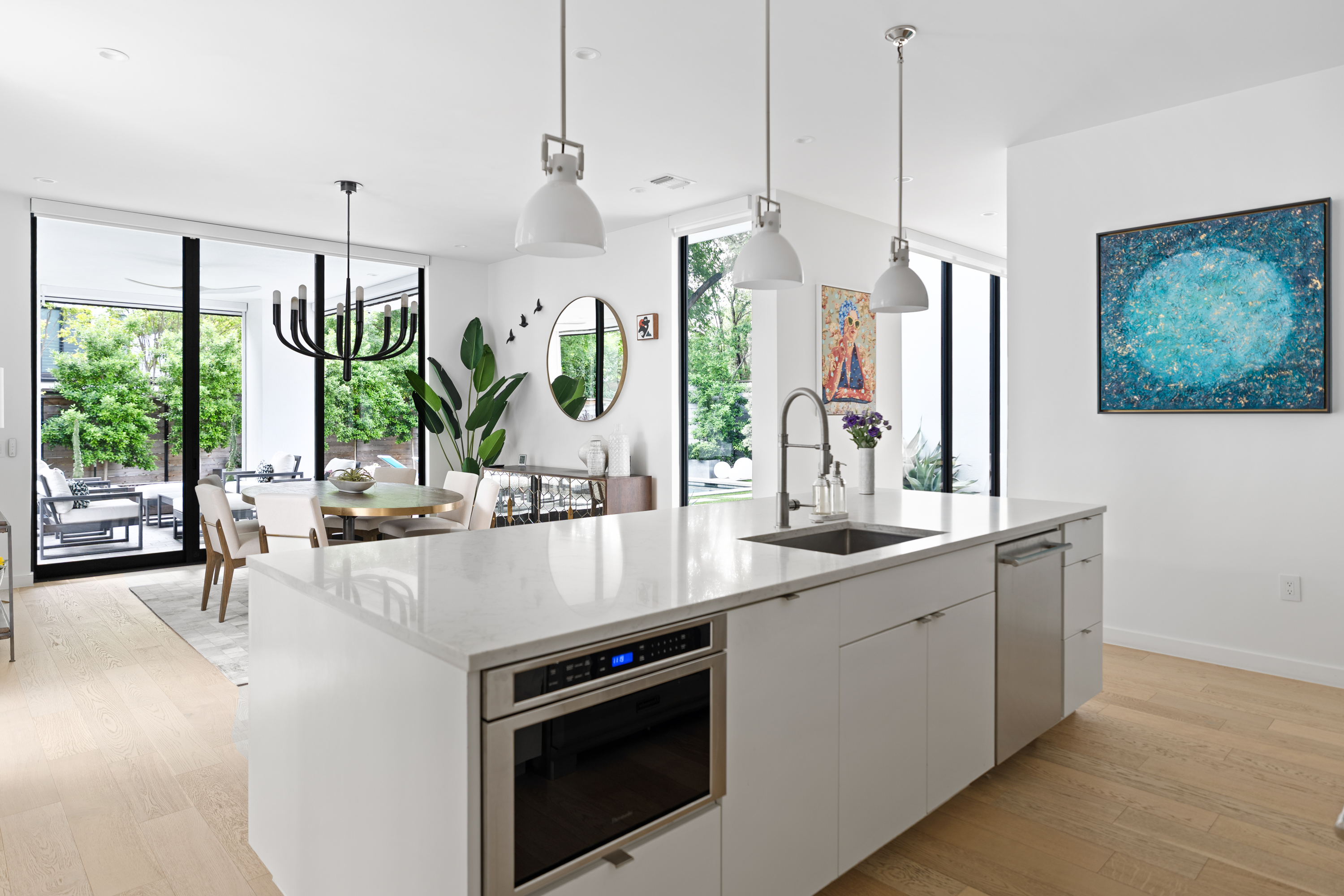 Address Upon Request Austin, TX 78704 - Photo 7 of 27 a kitchen with stainless steel appliances granite countertop a sink a stove and a large window