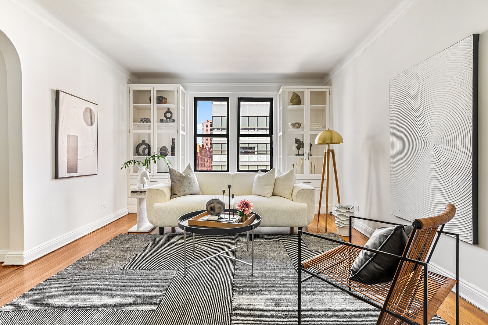 357 West 55th Street, Unit 4D Manhattan, NY 10019 - Photo 1 of 11 a living room with furniture and a window