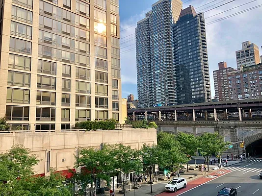 344 East 61st Street, Unit 12 Manhattan, NY 10065 - Photo 10 of 10 a front view of a building with street view