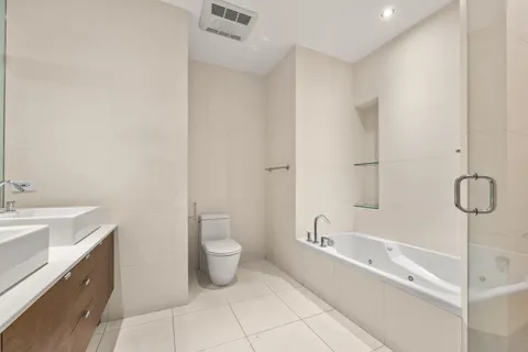 a spacious bathroom with a bathtub and sink