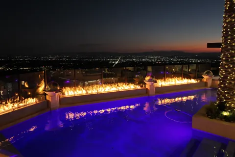 a view of swimming pool and outdoor seating