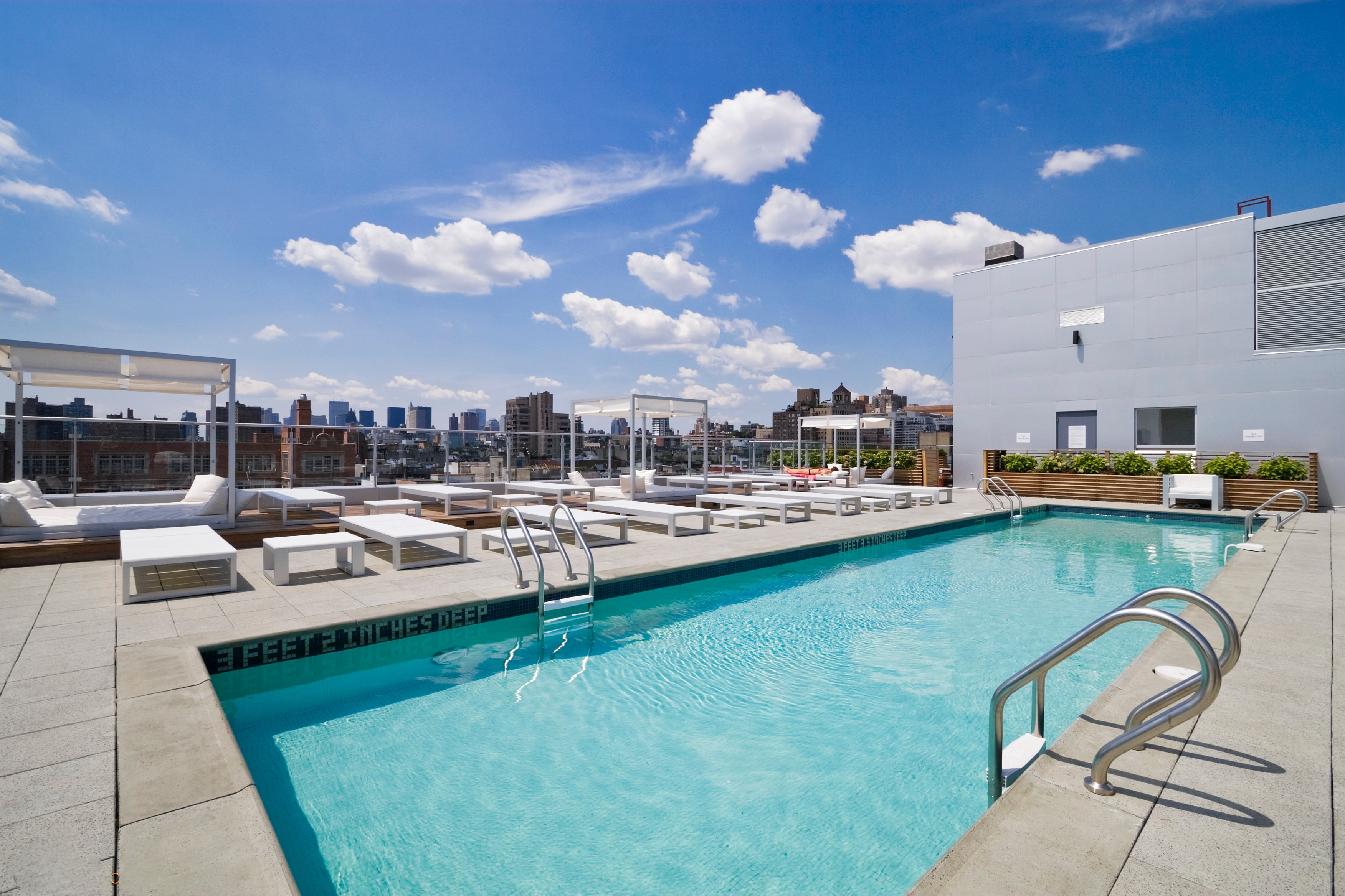 425 East 13th Street, Unit 3K Manhattan, NY 10009 - Photo 10 of 14 a view of a swimming pool and lounge chairs