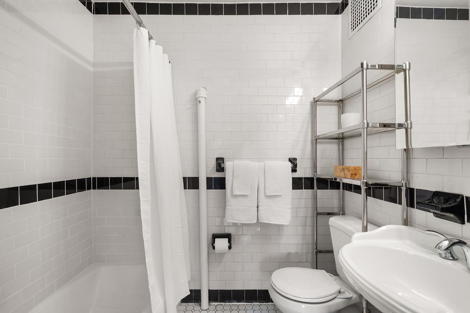30-32 West 9th Street, Unit 5A Manhattan, NY 10011 - Photo 12 of 18 a bathroom with a sink toilet and shower