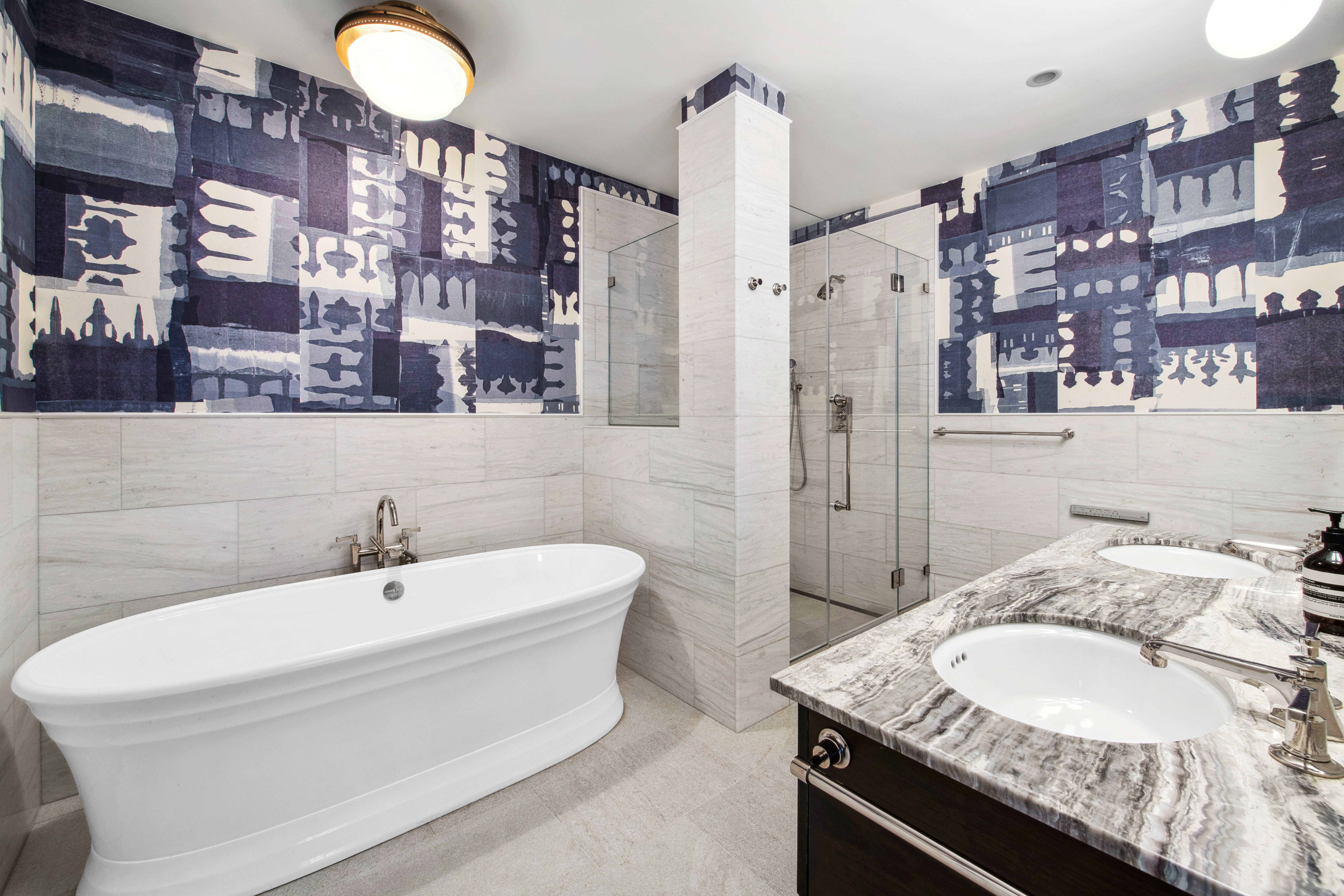 150 Nassau Street, Unit 10A Manhattan, NY 10038 - Photo 8 of 20 a bathroom with a granite countertop sink and a mirror