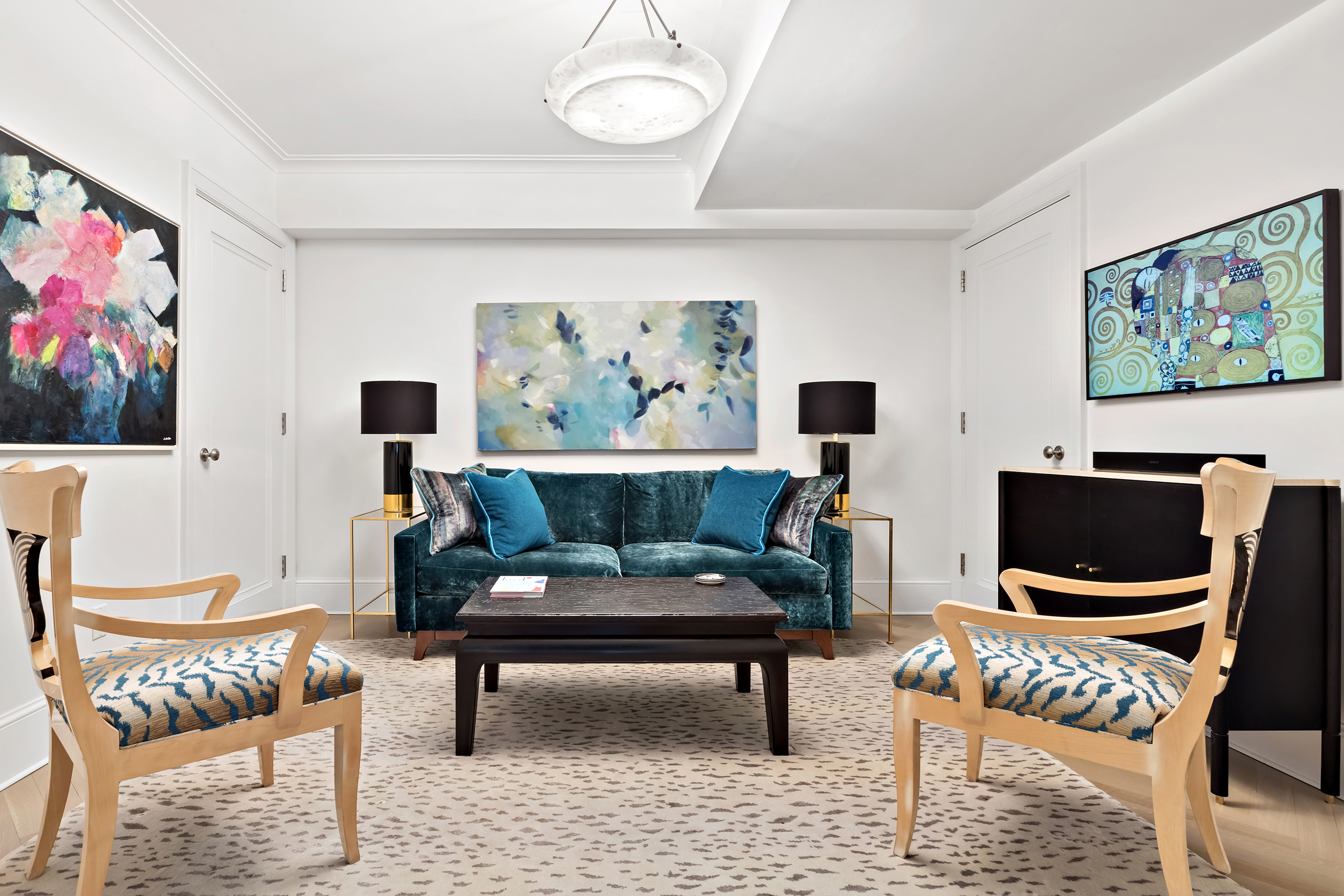 530 Park Avenue, Unit 10D Manhattan, NY 10065 - Photo 11 of 13 a living room with furniture a rug and a wall painting