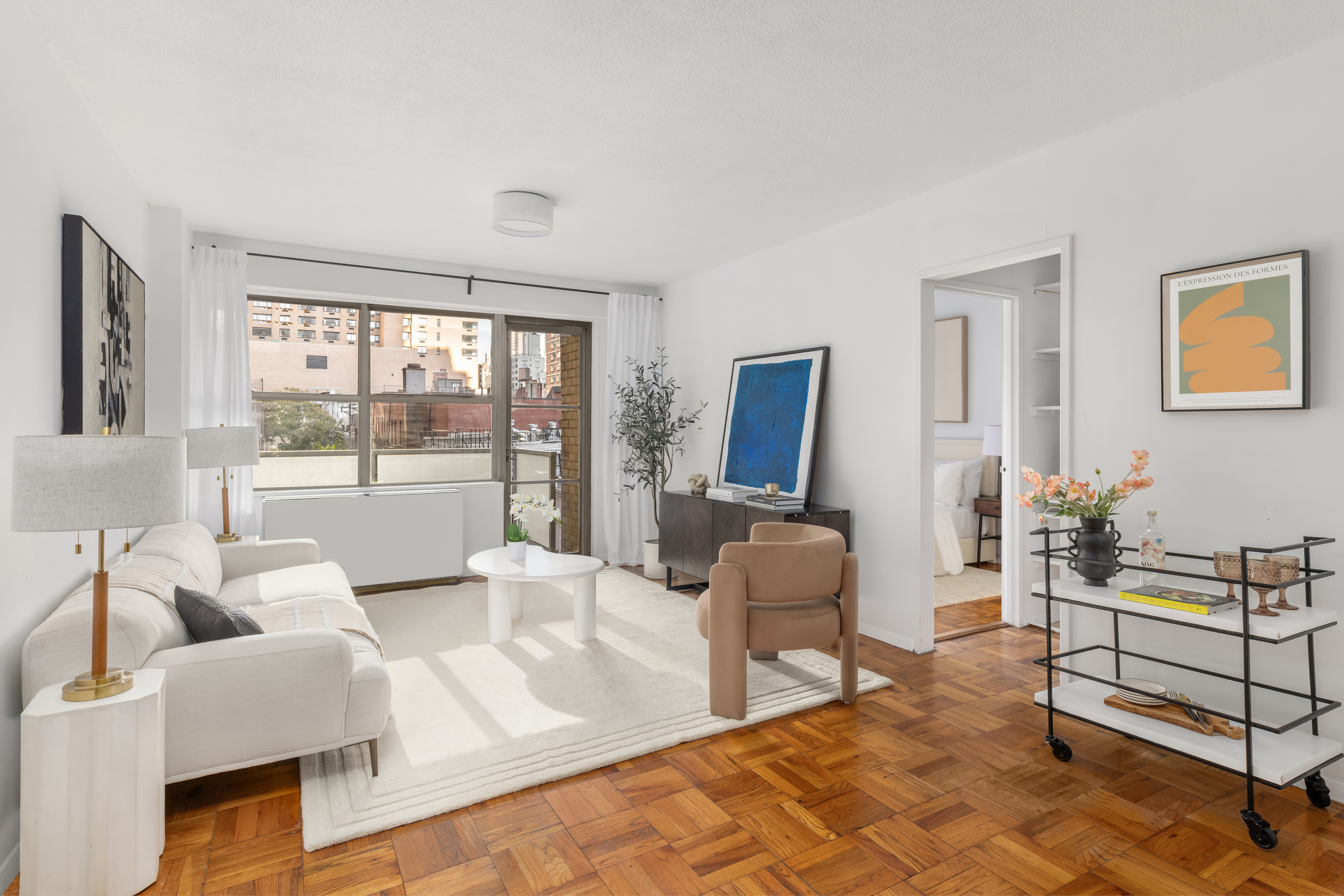 250 East 87th Street, Unit 6E Manhattan, NY 10128 - Photo 2 of 12 a living room with furniture and a window