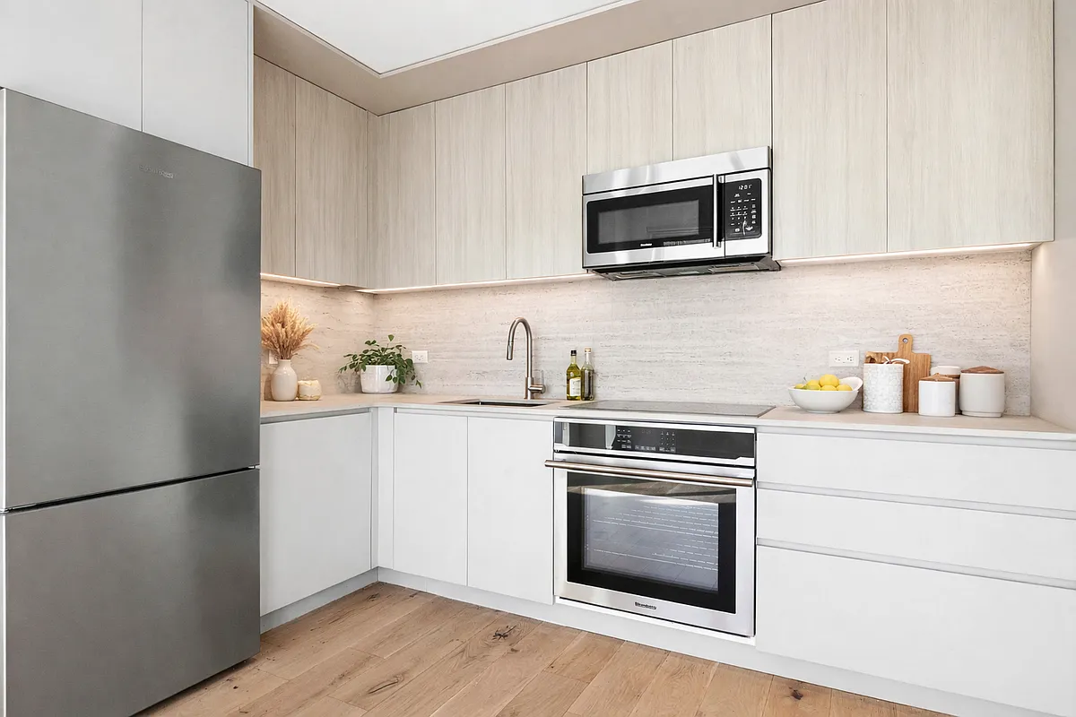 130 2nd Street, Unit 8F Brooklyn, NY 11231 - Photo 3 of 18 a kitchen with a refrigerator stove and microwave
