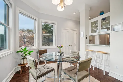 a dining room with furniture and window