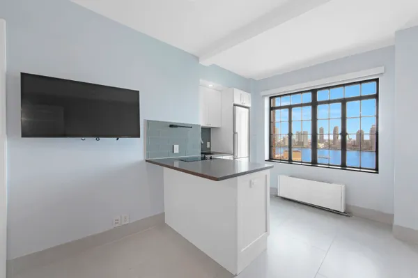 a kitchen with stainless steel appliances a microwave a sink and a stove