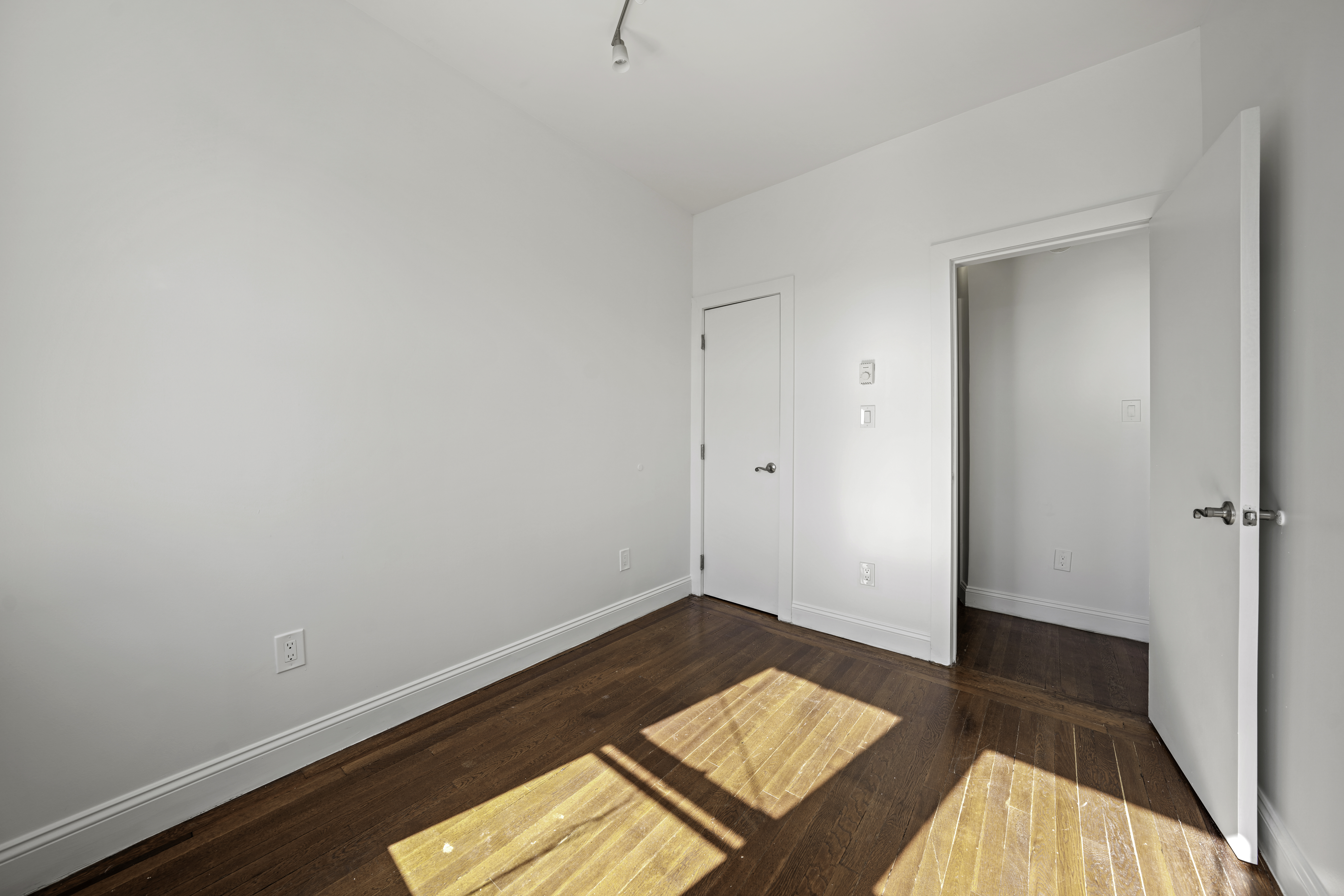 514 86th Street, Unit 4 Brooklyn, NY 11209 - Photo 17 of 19 a view of a room with wooden floor