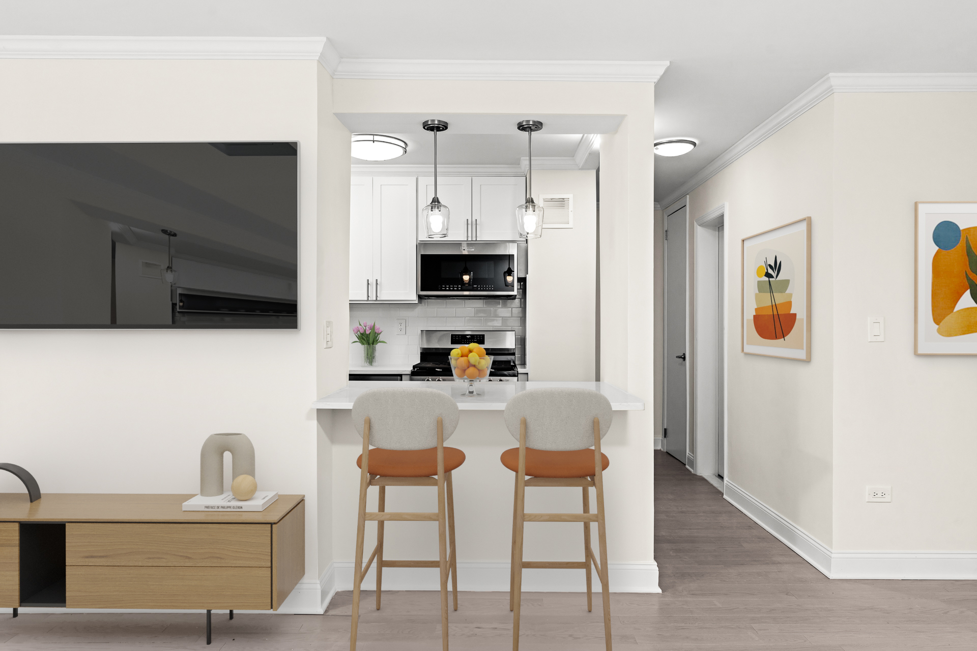 191 Willoughby Street, Unit 14J Brooklyn, NY 11201 - Photo 4 of 16 a kitchen with stainless steel appliances a refrigerator a stove a sink a dining table and chairs