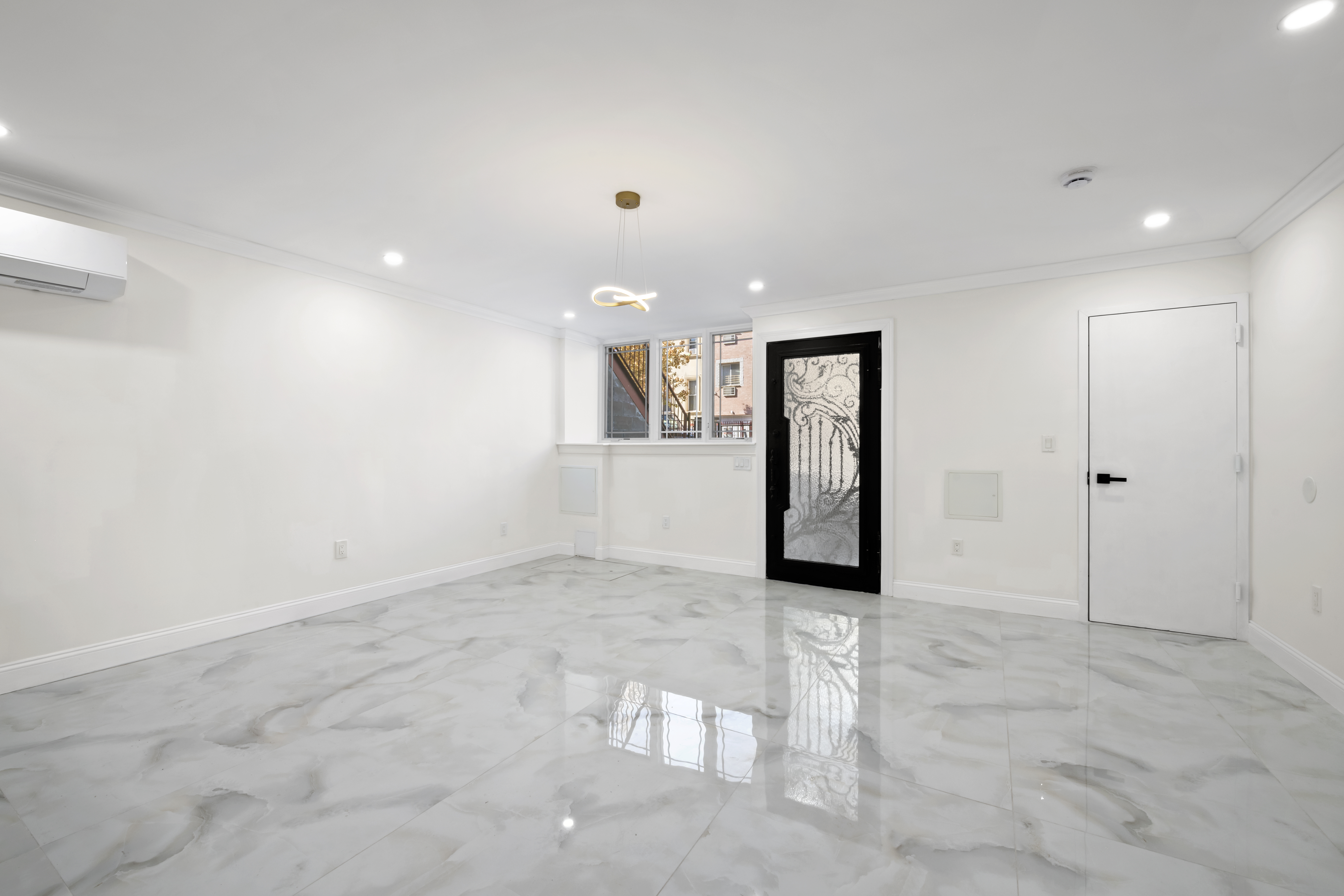 84 Himrod Street Brooklyn, NY 11221 - Photo 25 of 35 an empty room with entrance and windows