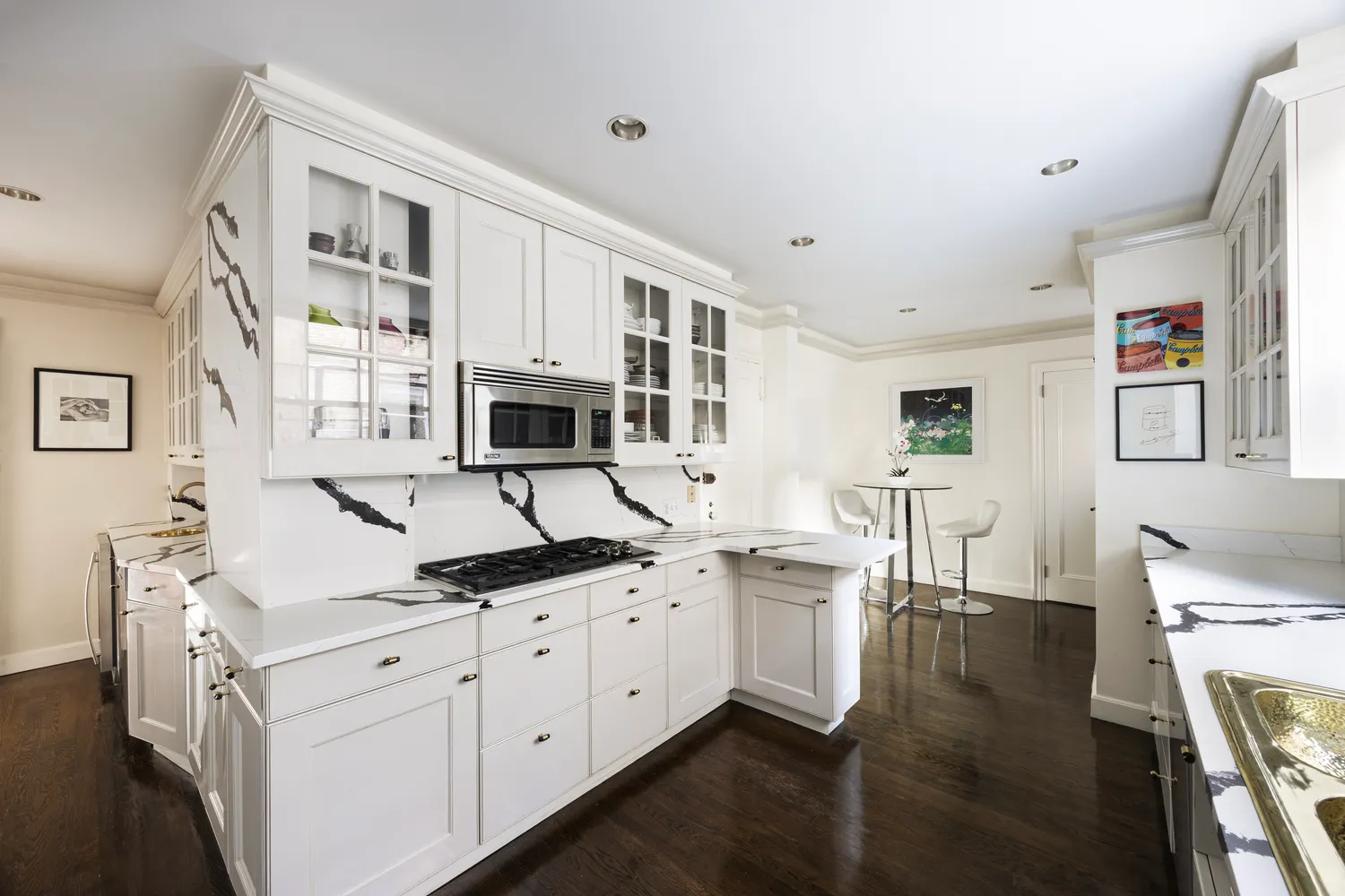 a kitchen with stainless steel appliances granite countertop a sink and cabinets