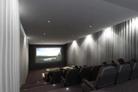 a room with furniture projector and screen
