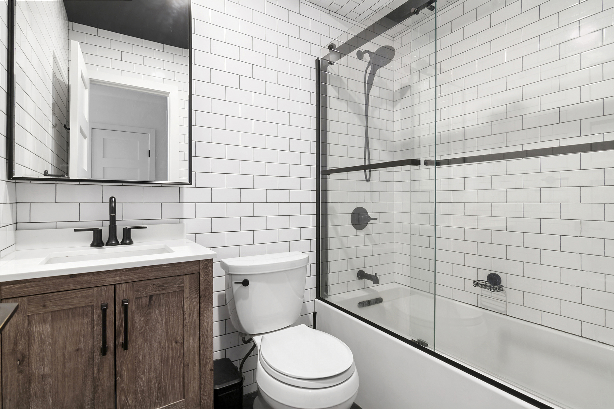 106 Battery Avenue, Unit 301 Brooklyn, NY 11209 - Photo 6 of 8 a bathroom with a sink a toilet and shower