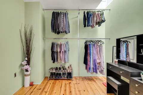 a bed room with a bed and a mirror