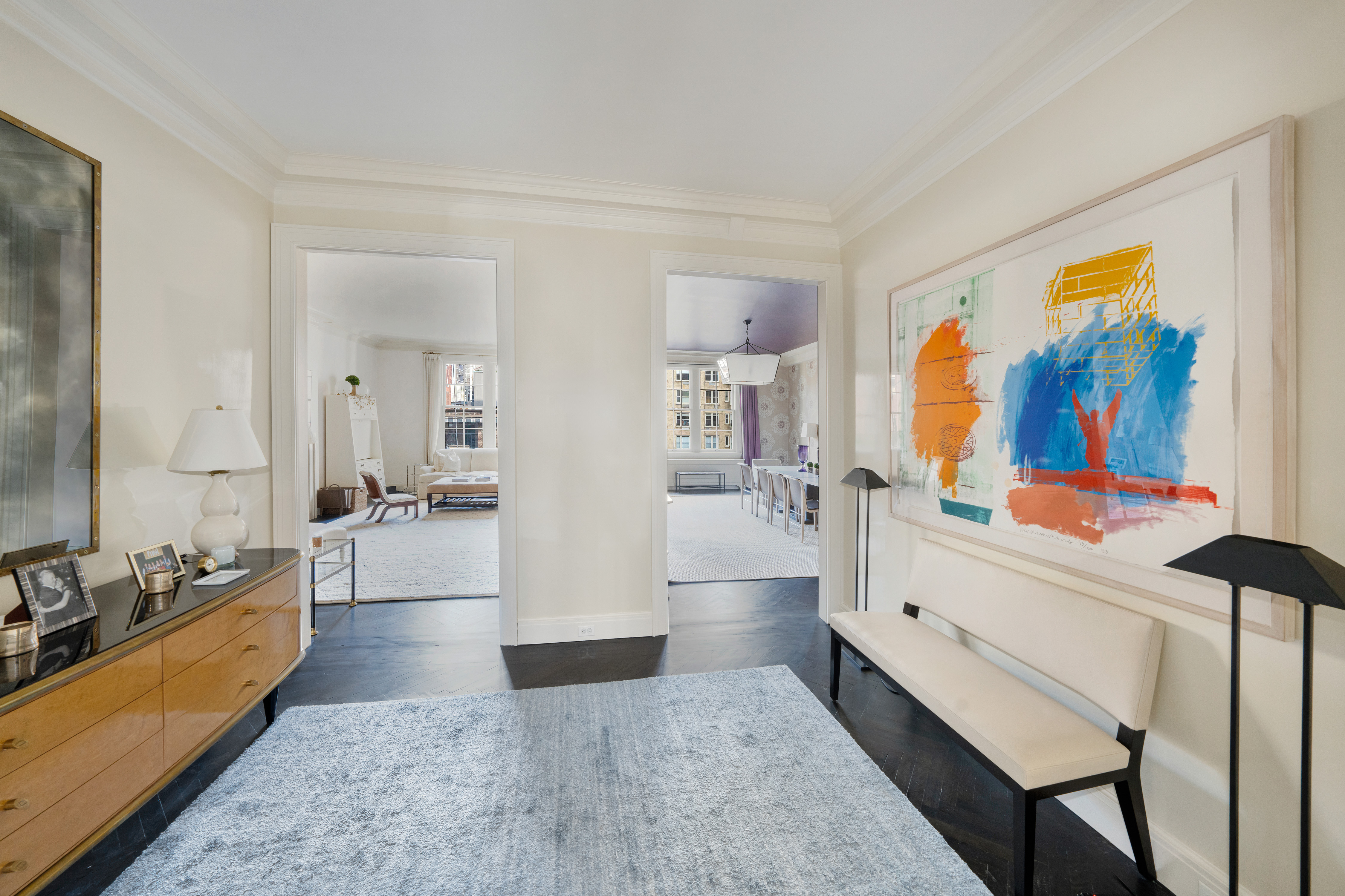 850 Park Avenue, Unit 9C Manhattan, NY 10075 - Photo 7 of 14 a large living room with stainless steel appliances kitchen island granite countertop furniture and a rug