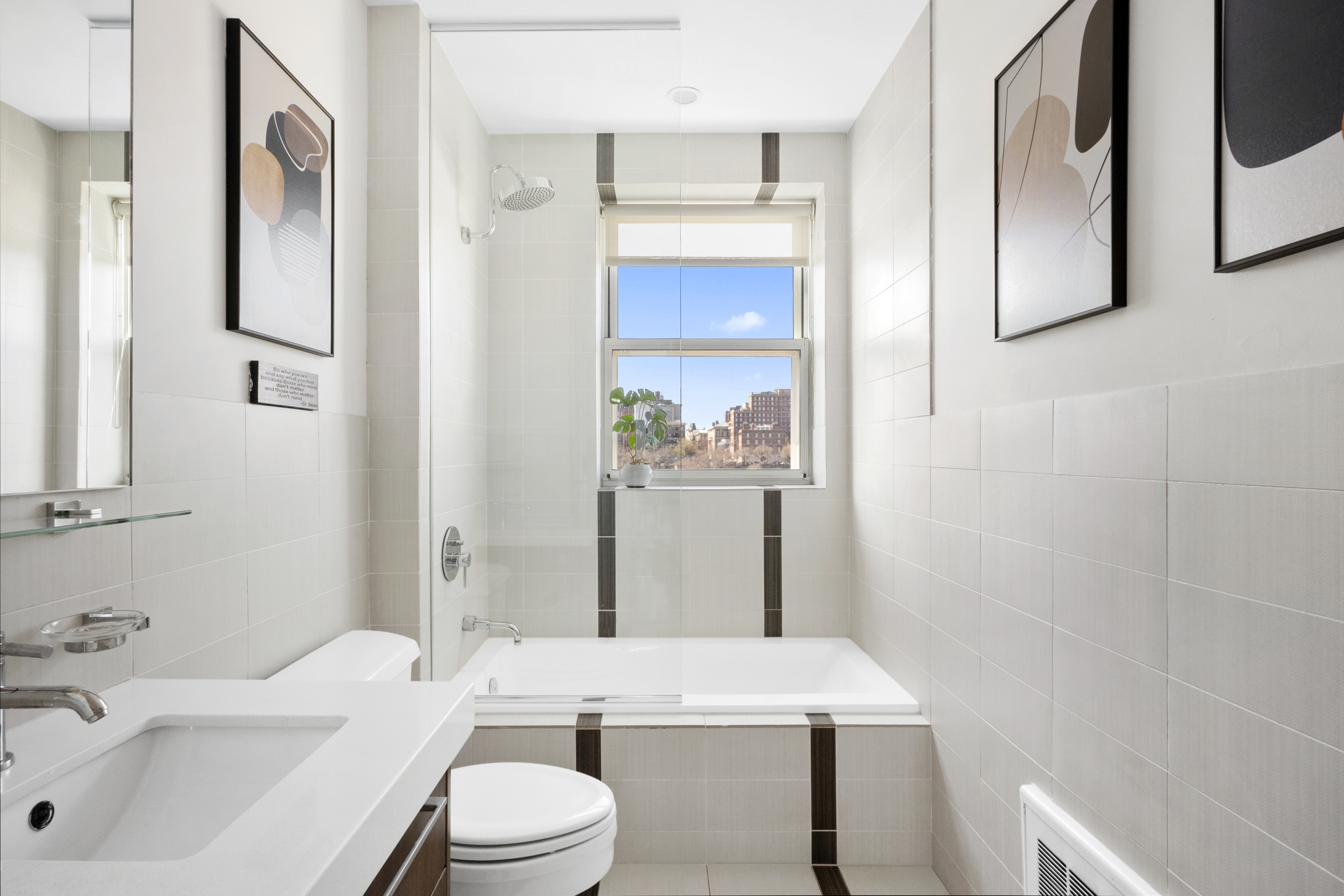 301 West 115th Street, Unit PH4C Manhattan, NY 10026 - Photo 7 of 15 a bathroom with a sink a toilet and shower