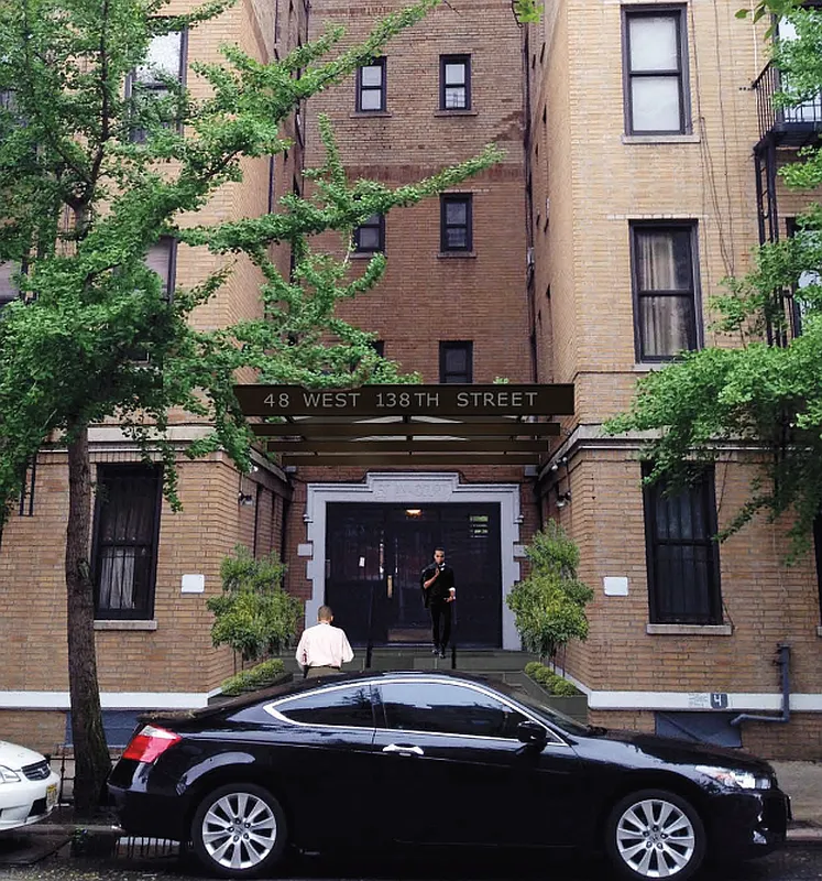 48 West 138th Street, Unit 5J Manhattan, NY 10037 - Photo 12 of 13 a front view of a house with yard