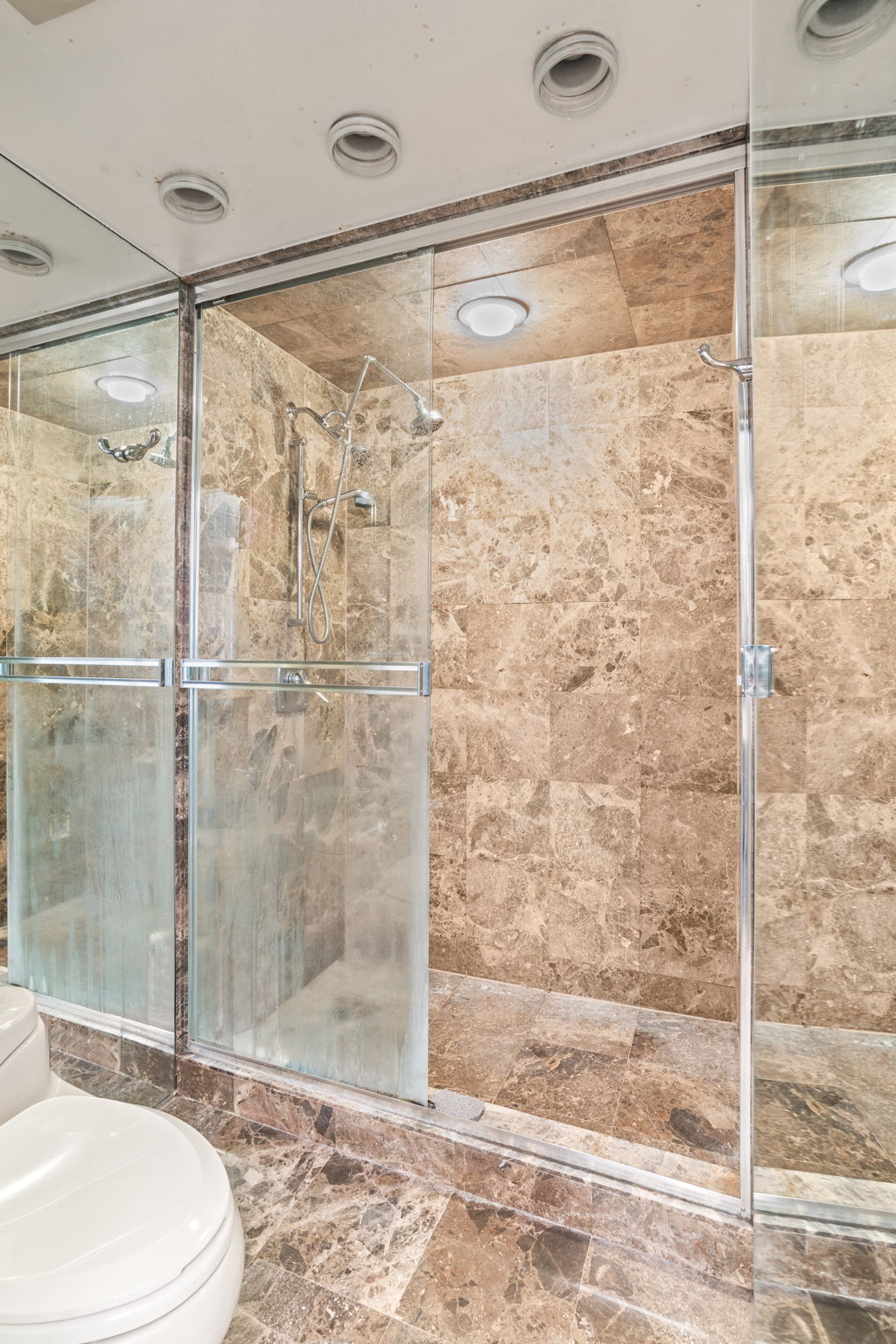 363 East 76th Street, Unit 2F Manhattan, NY 10075 - Photo 13 of 21 a bathroom with a shower and a toilet